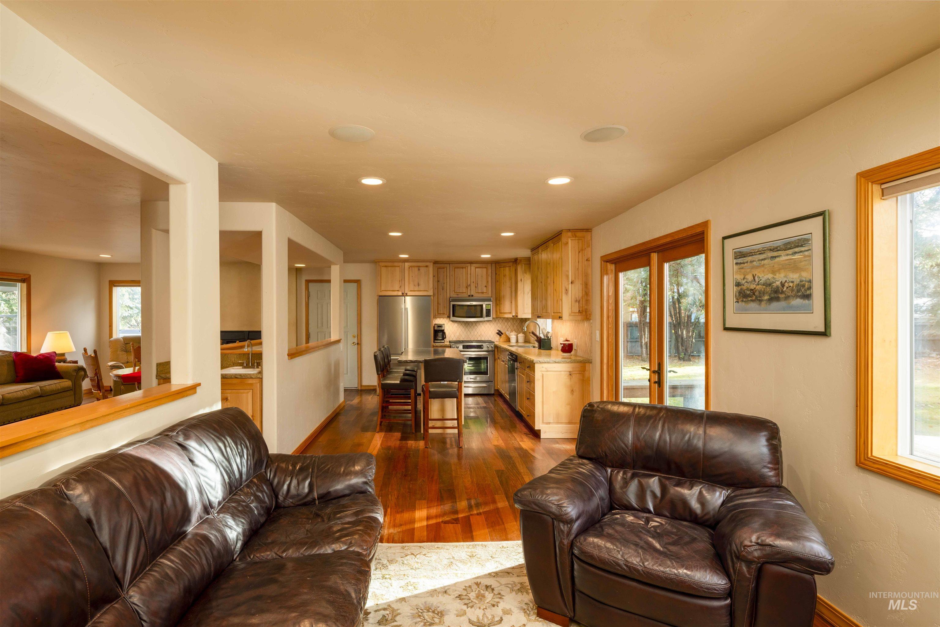 Living room featuring light wood-style floors and recessed lighting