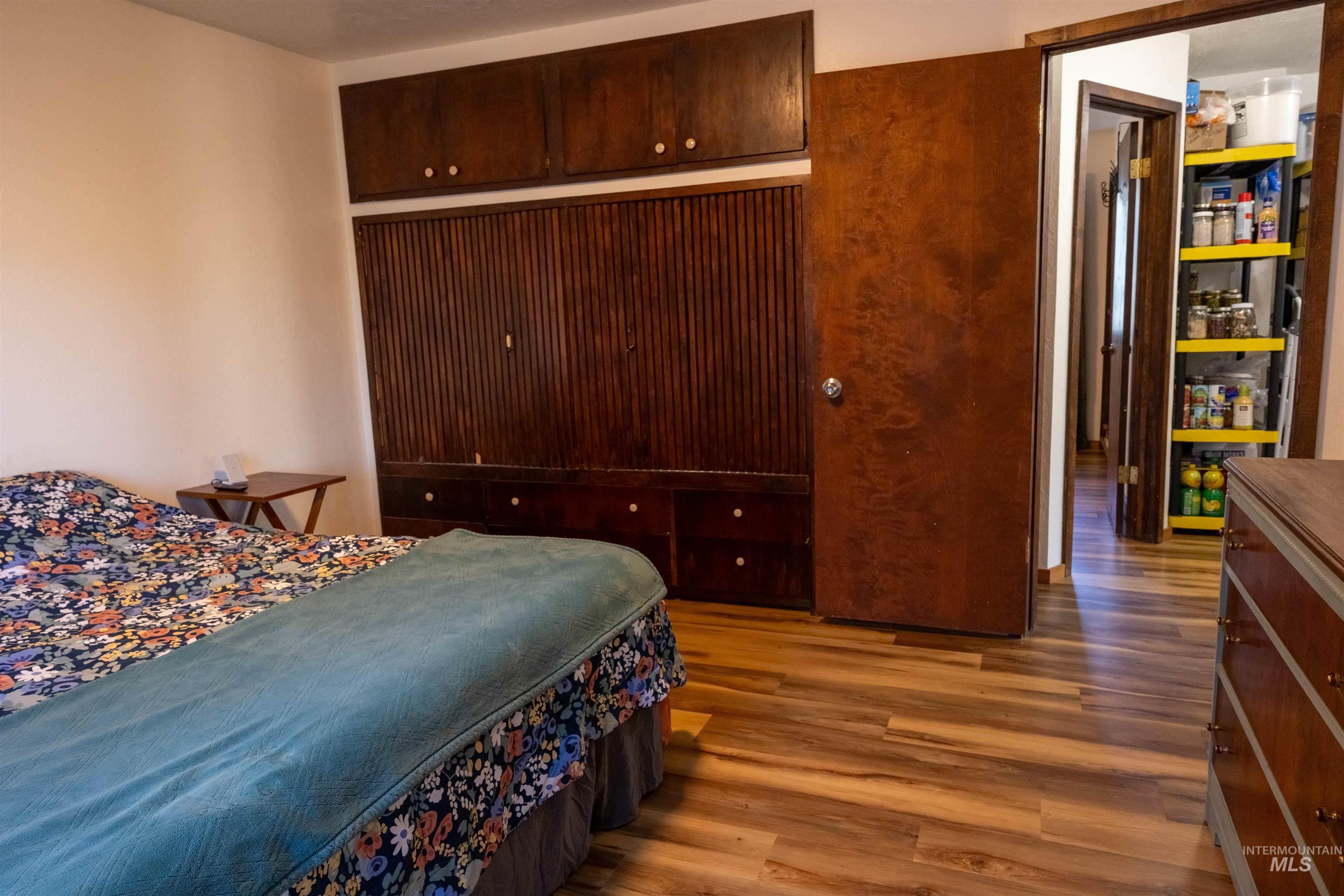 Bedroom with wood finished floors
