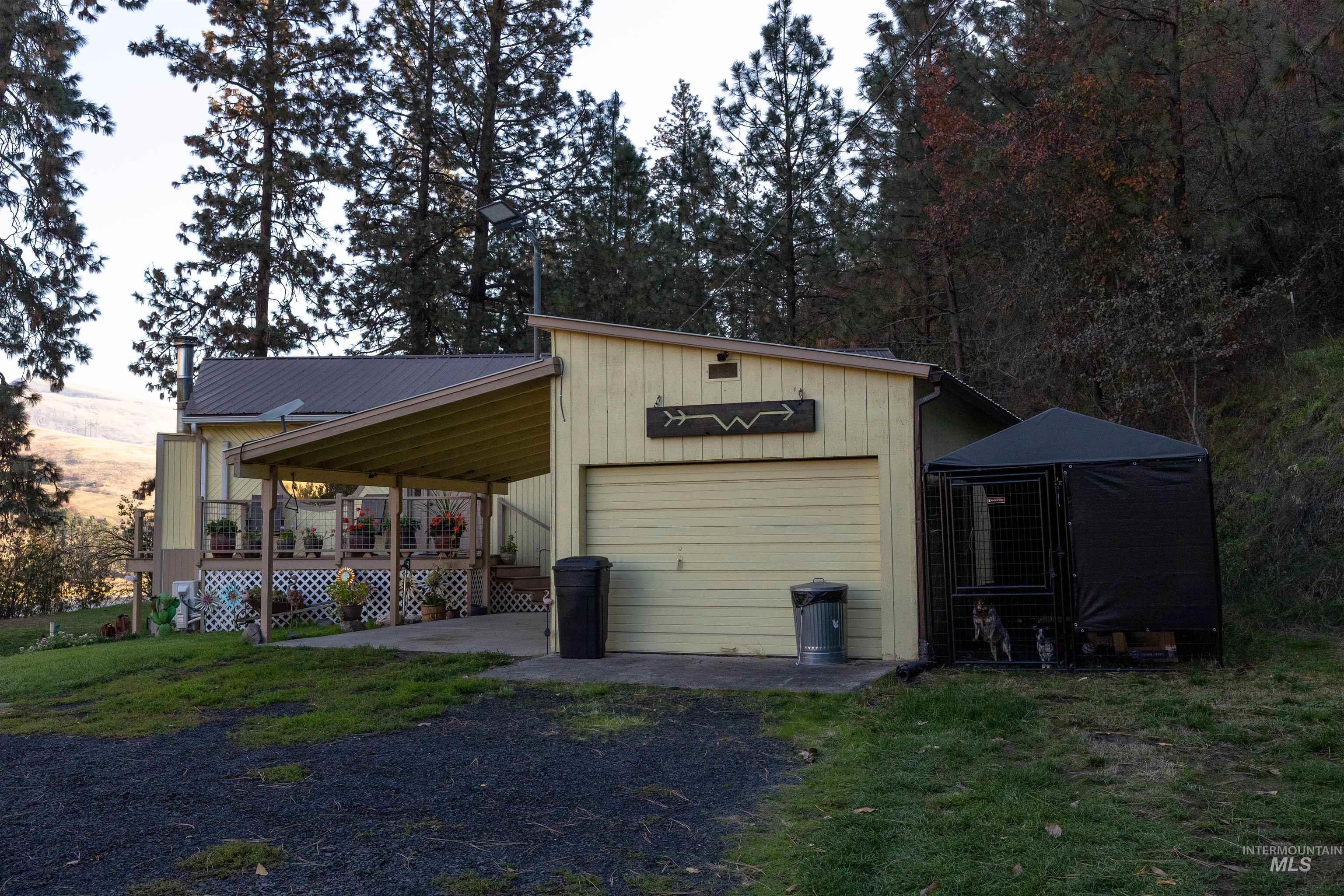 View of outbuilding featuring driveway
