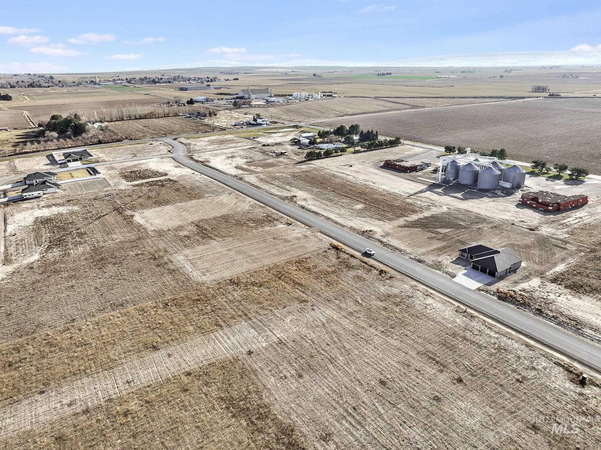 Aerial view of sparsely populated area featuring farmland