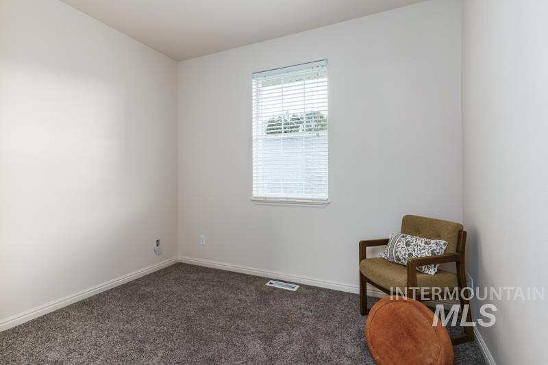 Living area with carpet flooring