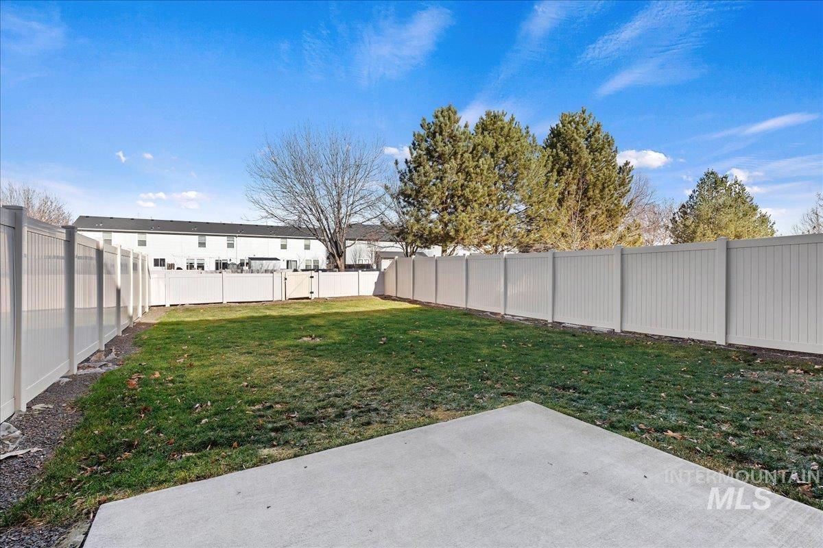 Fenced backyard featuring a patio area