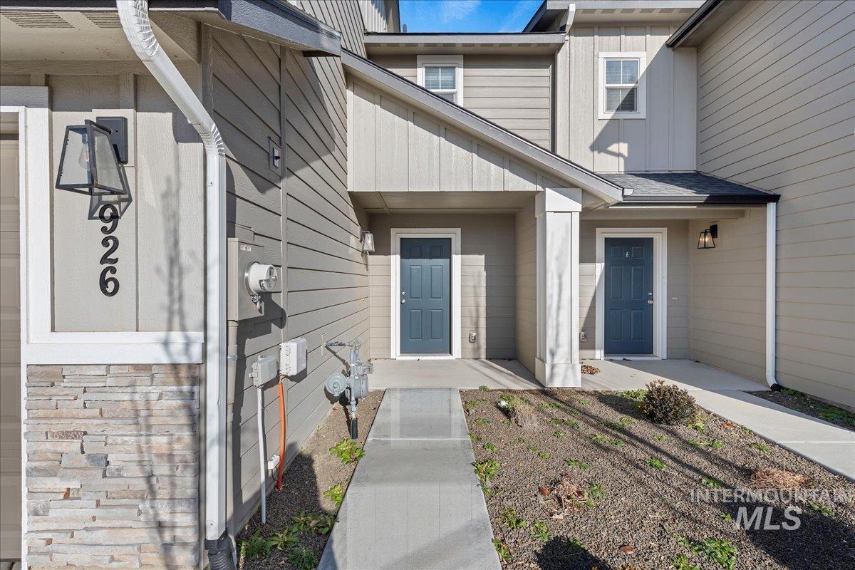 Entrance to property featuring board and batten siding
