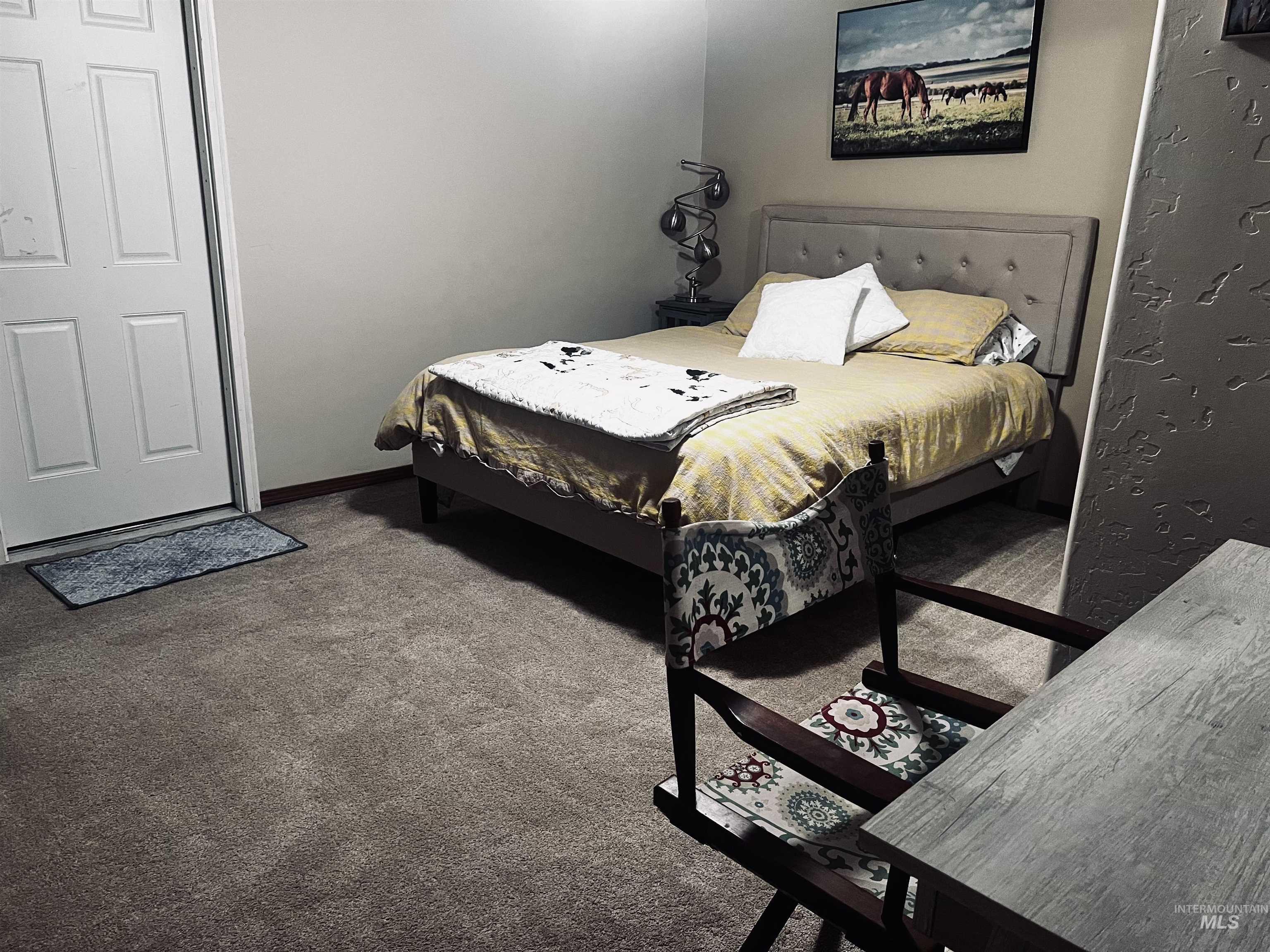 Bedroom with carpet floors and baseboards