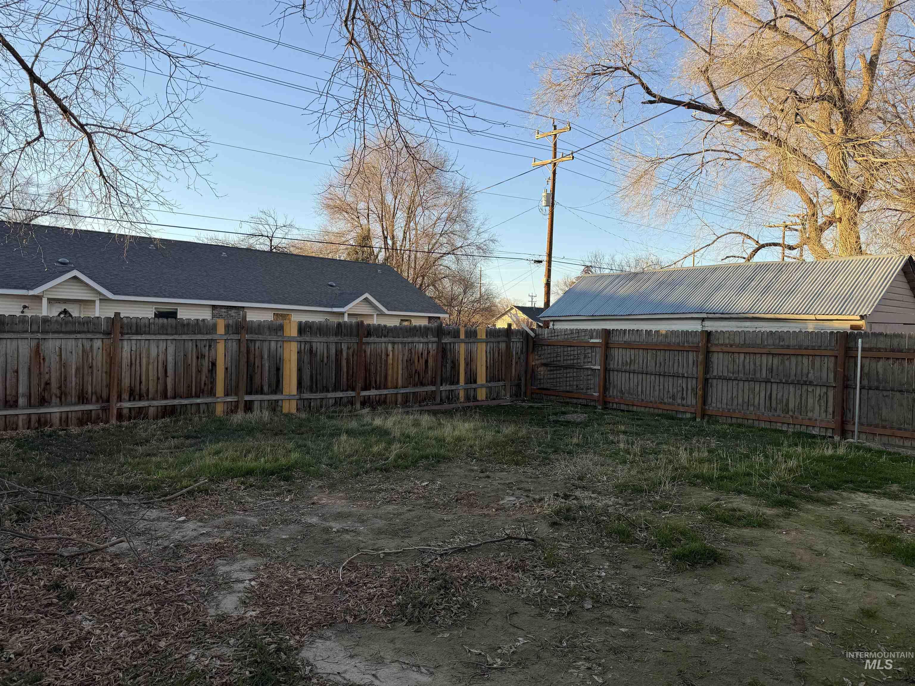 View of fenced backyard