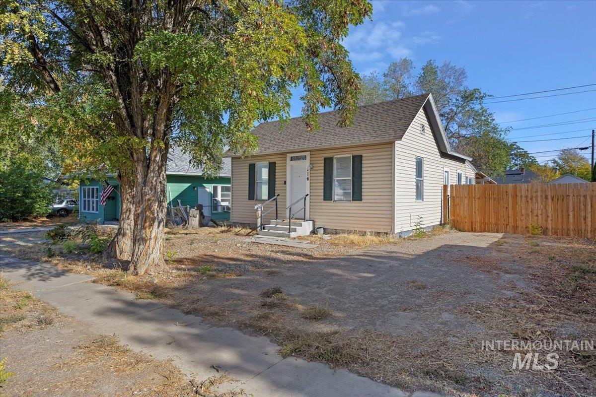 Bungalow-style house featuring a shingled roof