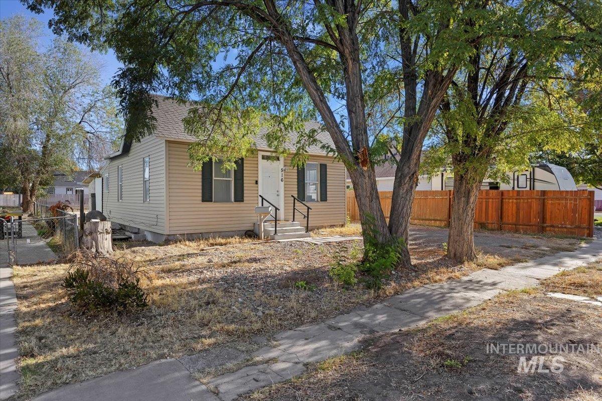 View of front of property featuring roof with shingles
