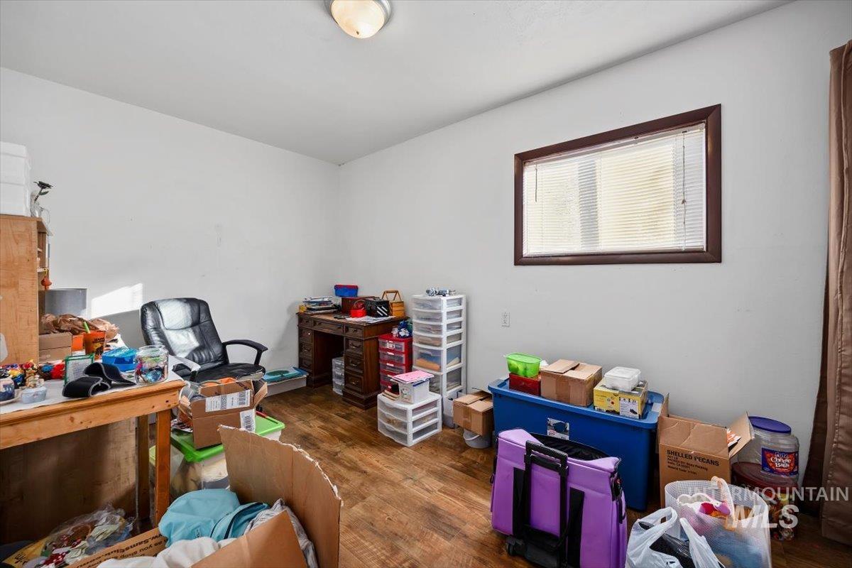 Office space with dark wood-type flooring