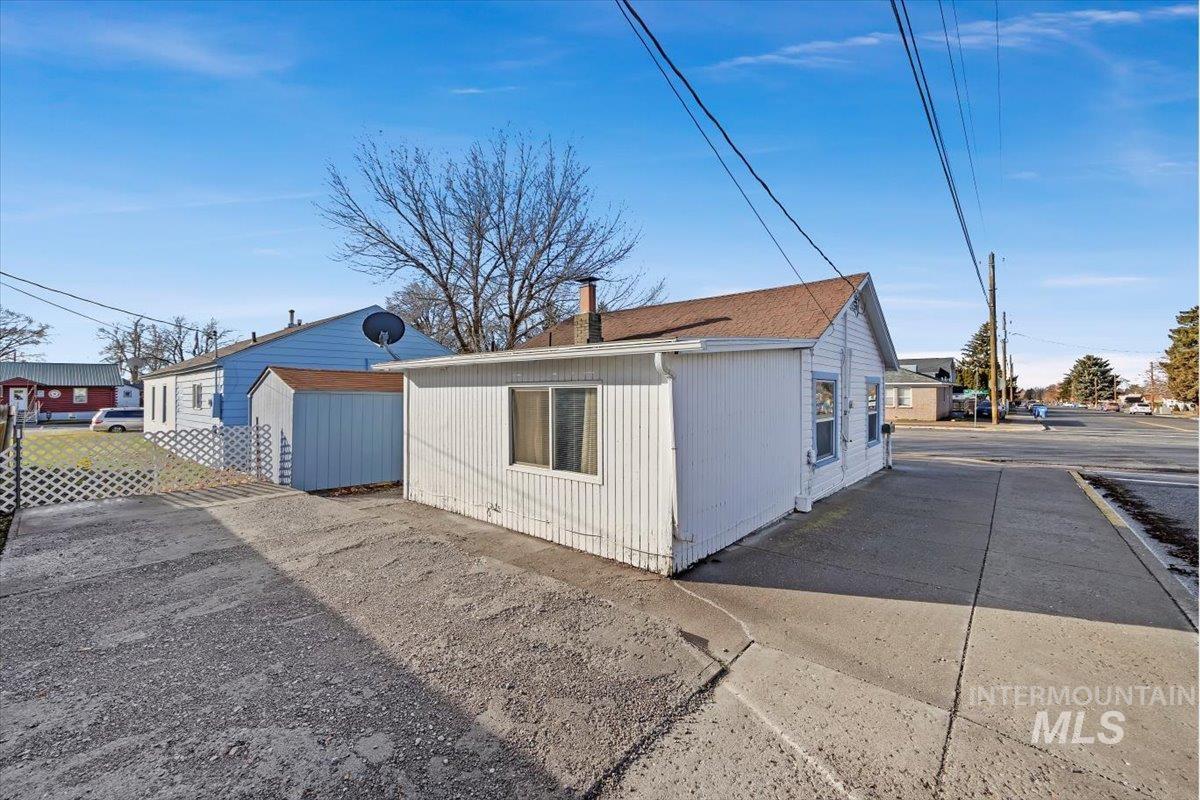 View of side of home with a chimney