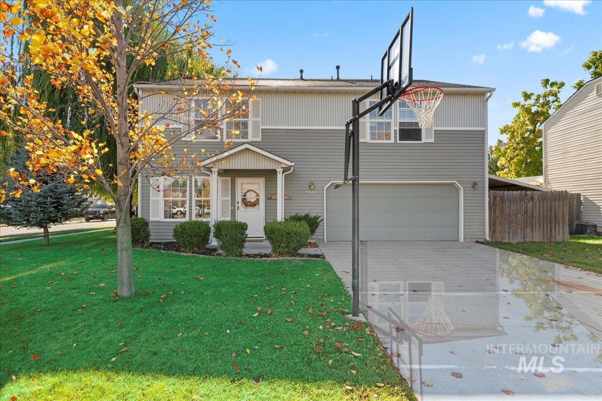 Traditional-style home with driveway and a garage
