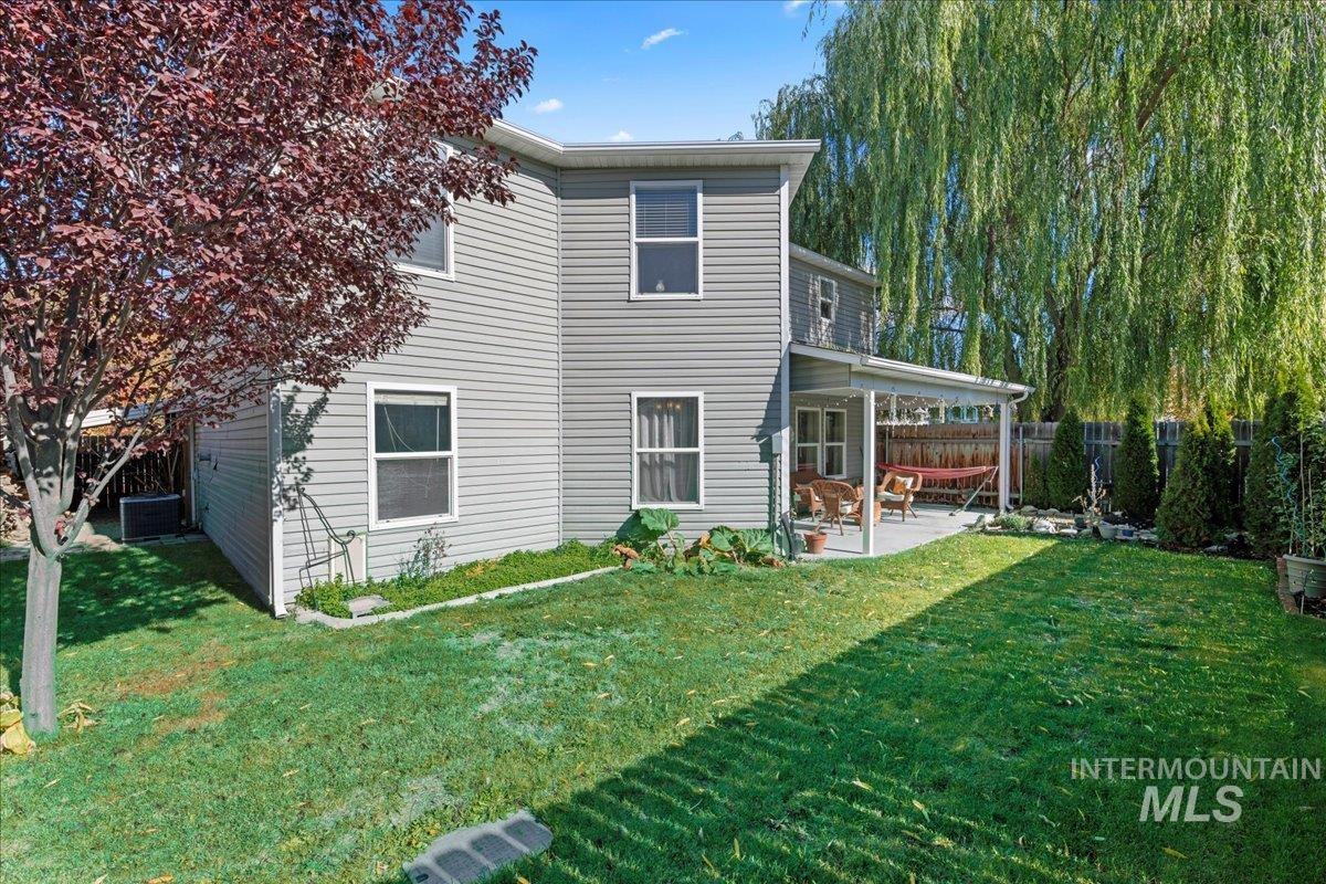 Back of property with a patio and a fenced backyard