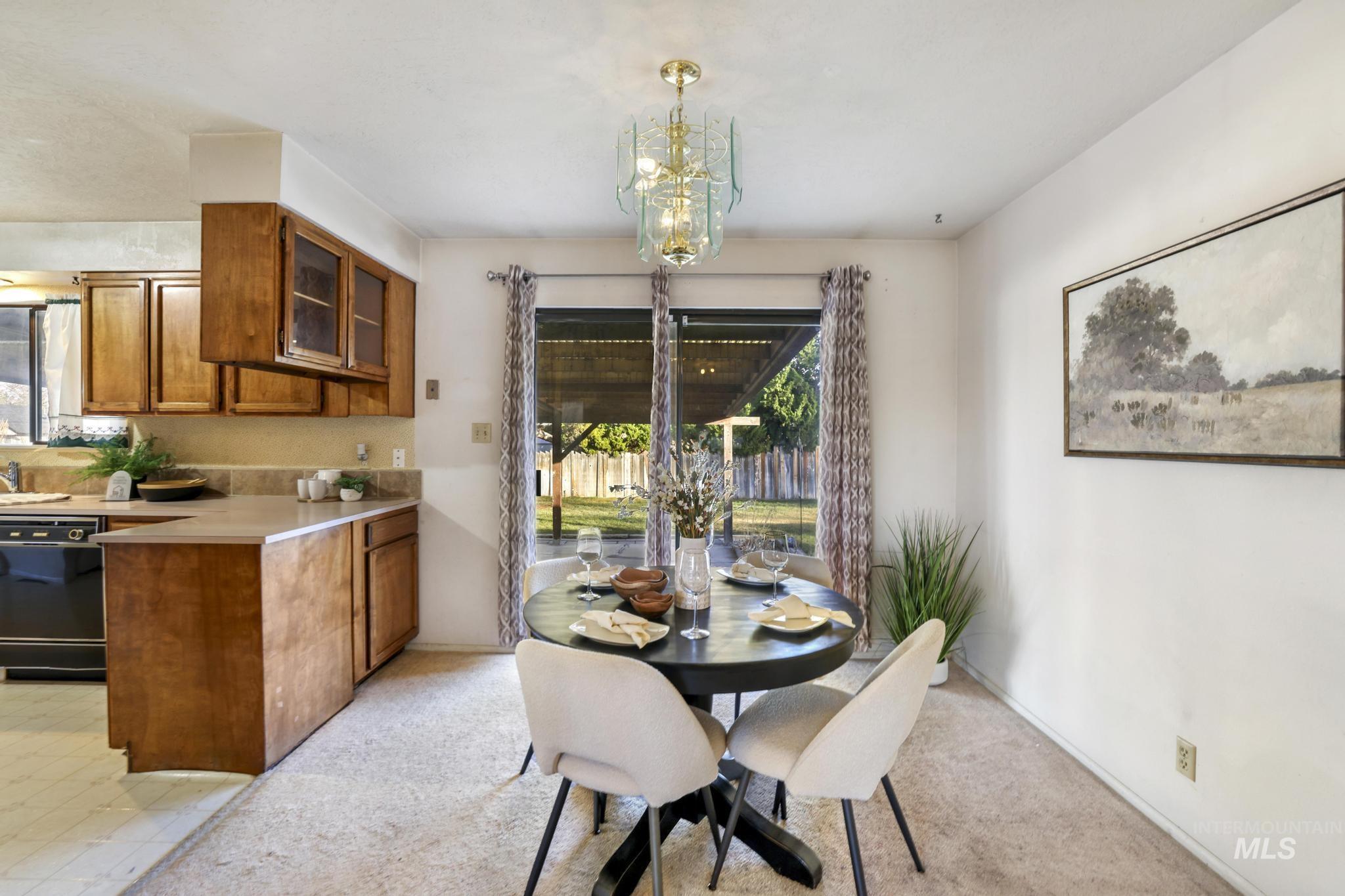 Dining area featuring plenty of natural light and a chandelier