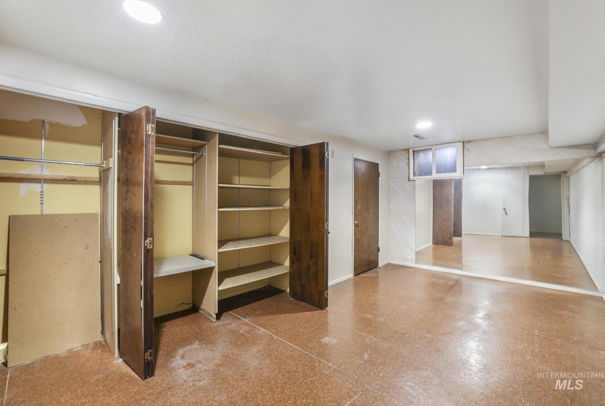 Finished basement featuring recessed lighting