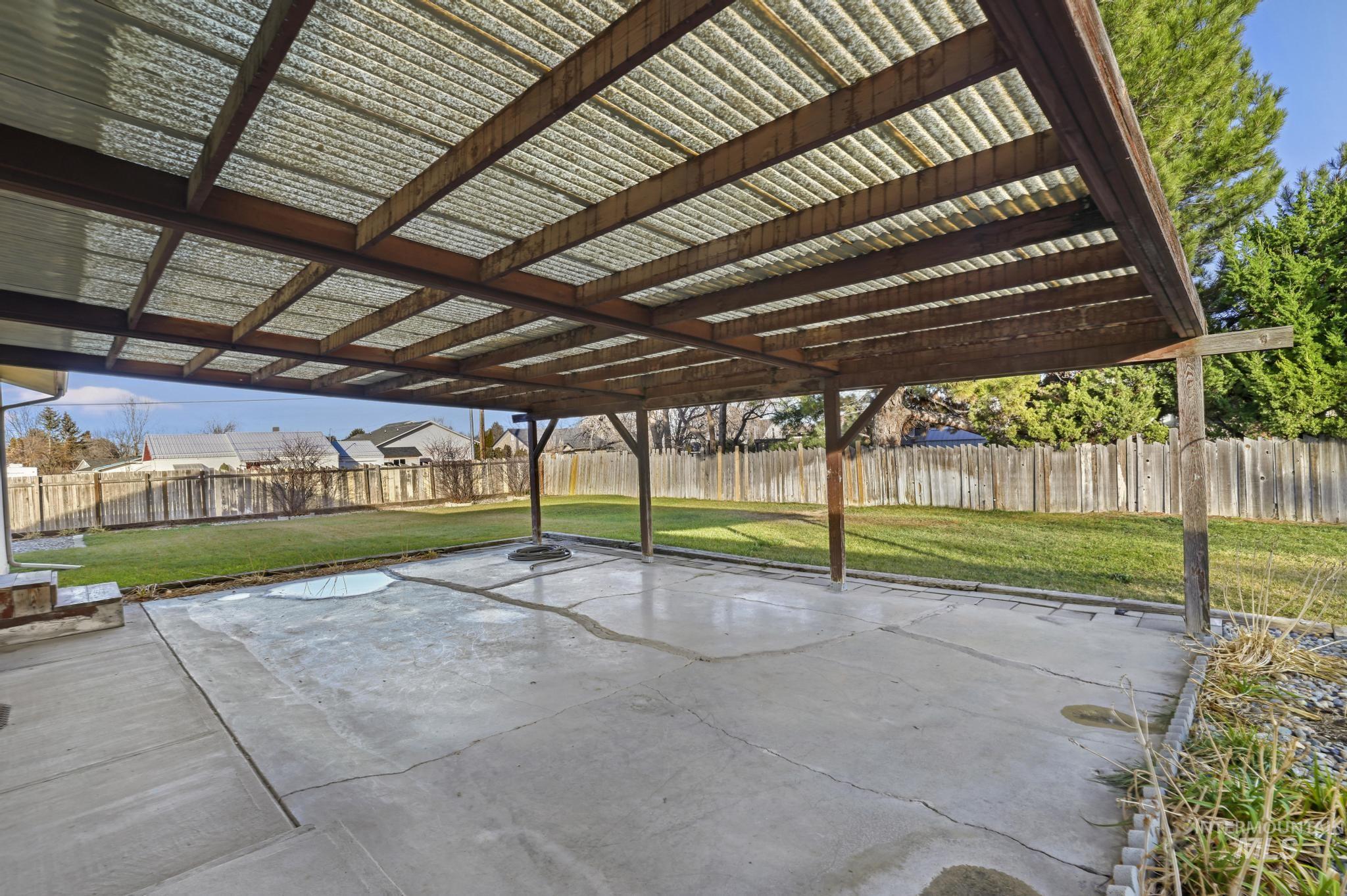 Fenced backyard featuring a patio area