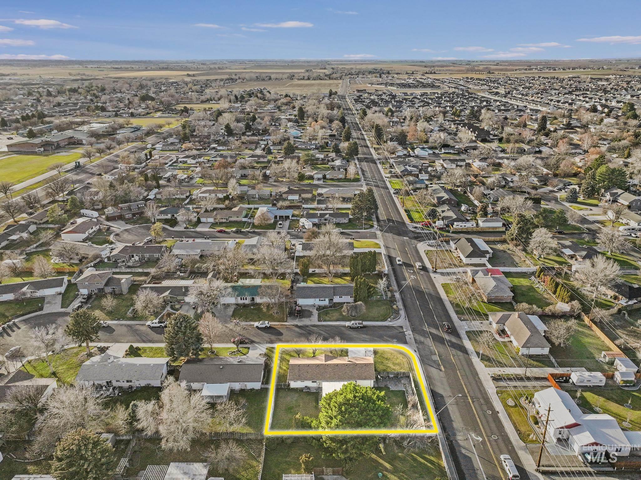 Aerial perspective of suburban area with property parcel outlined
