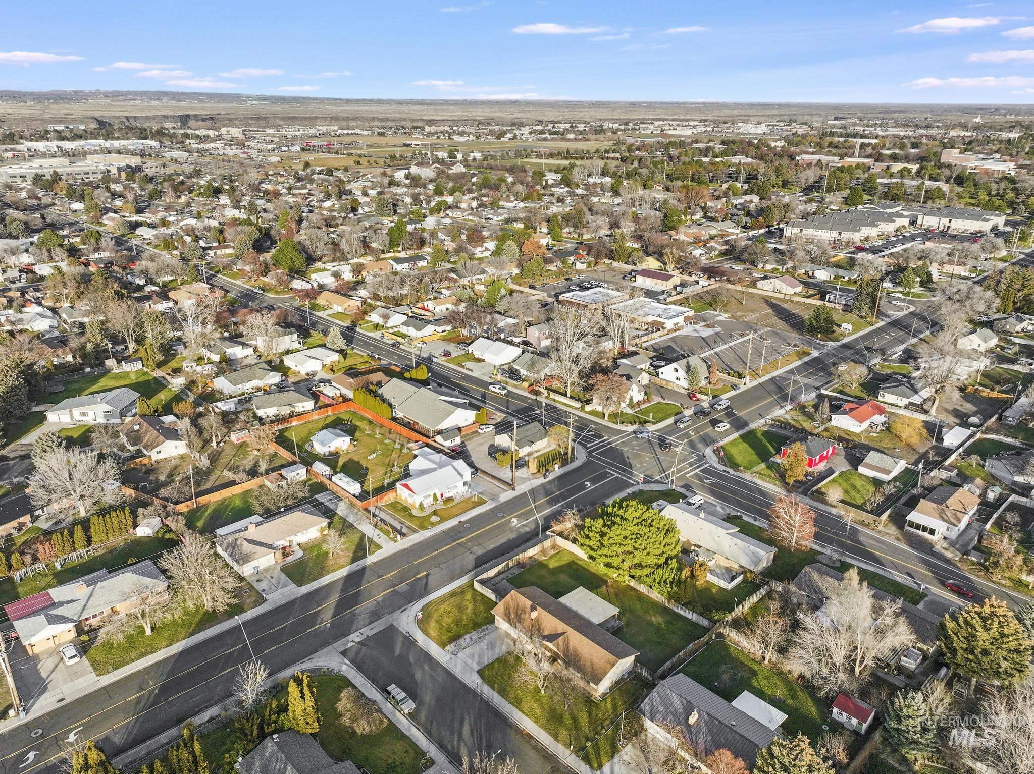 View of property location with nearby suburban area