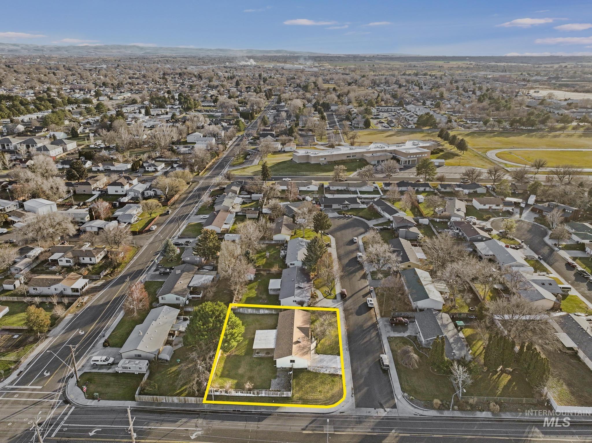 Aerial perspective of suburban area with property boundaries highlighted