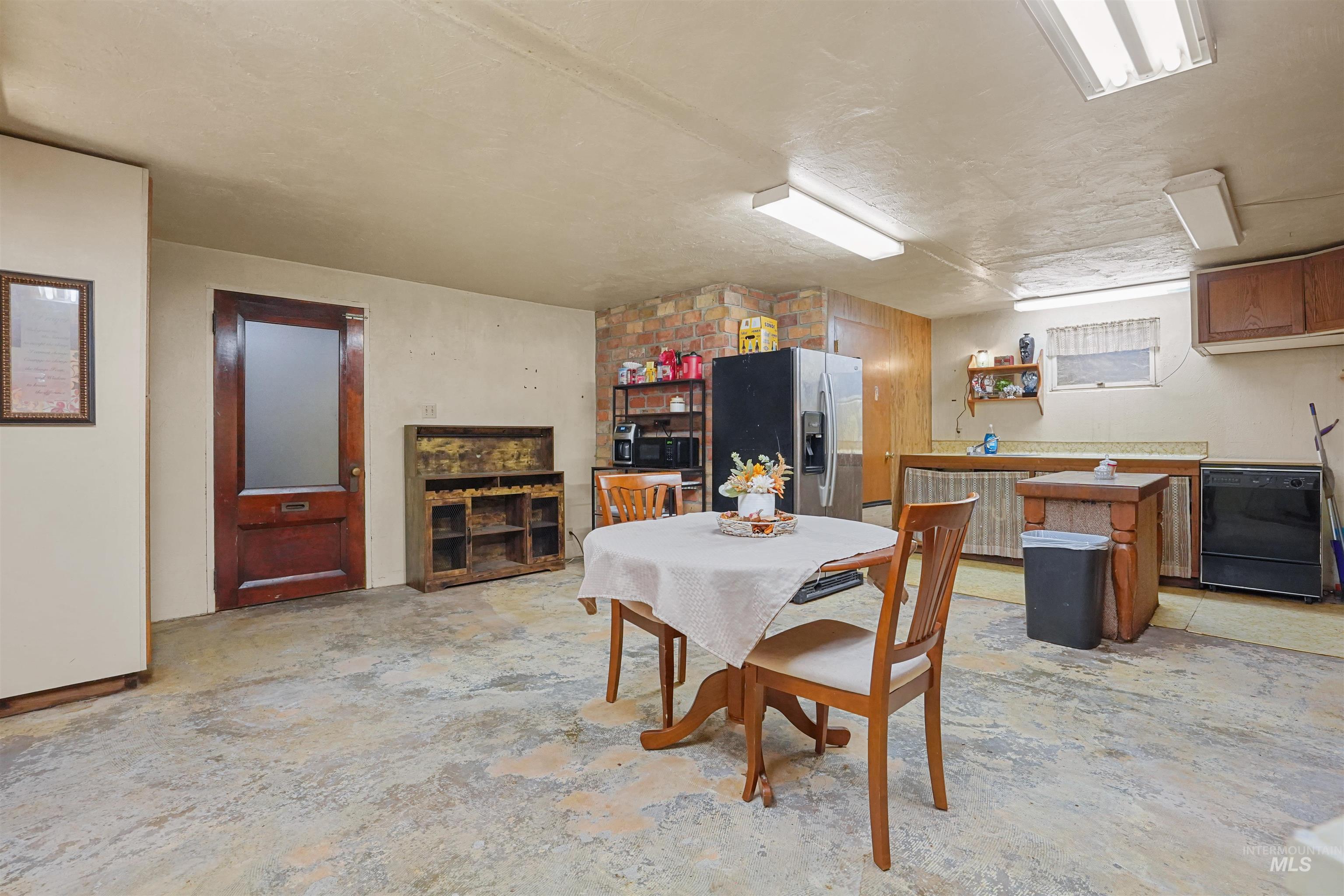Dining space featuring concrete flooring