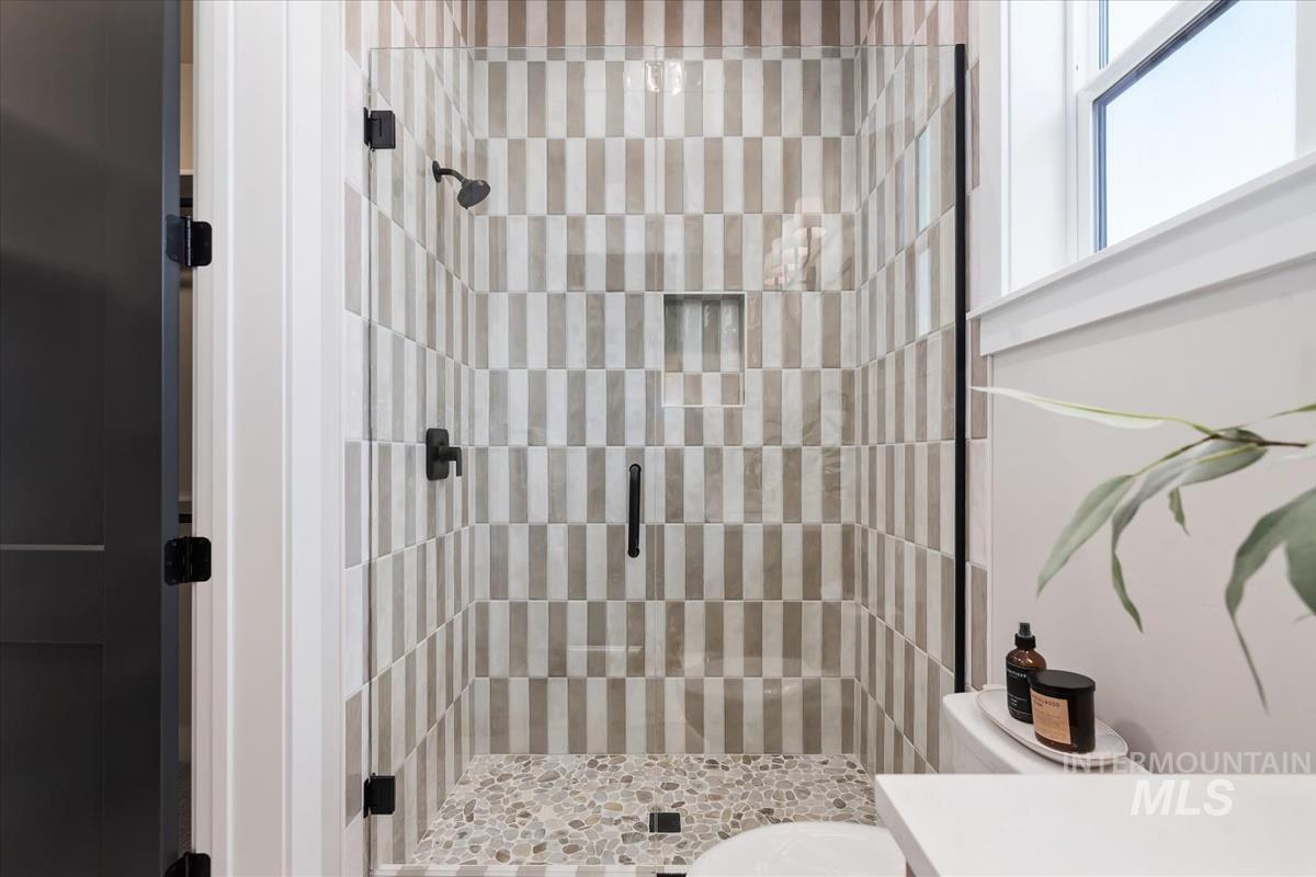 Bathroom with a shower stall and vanity