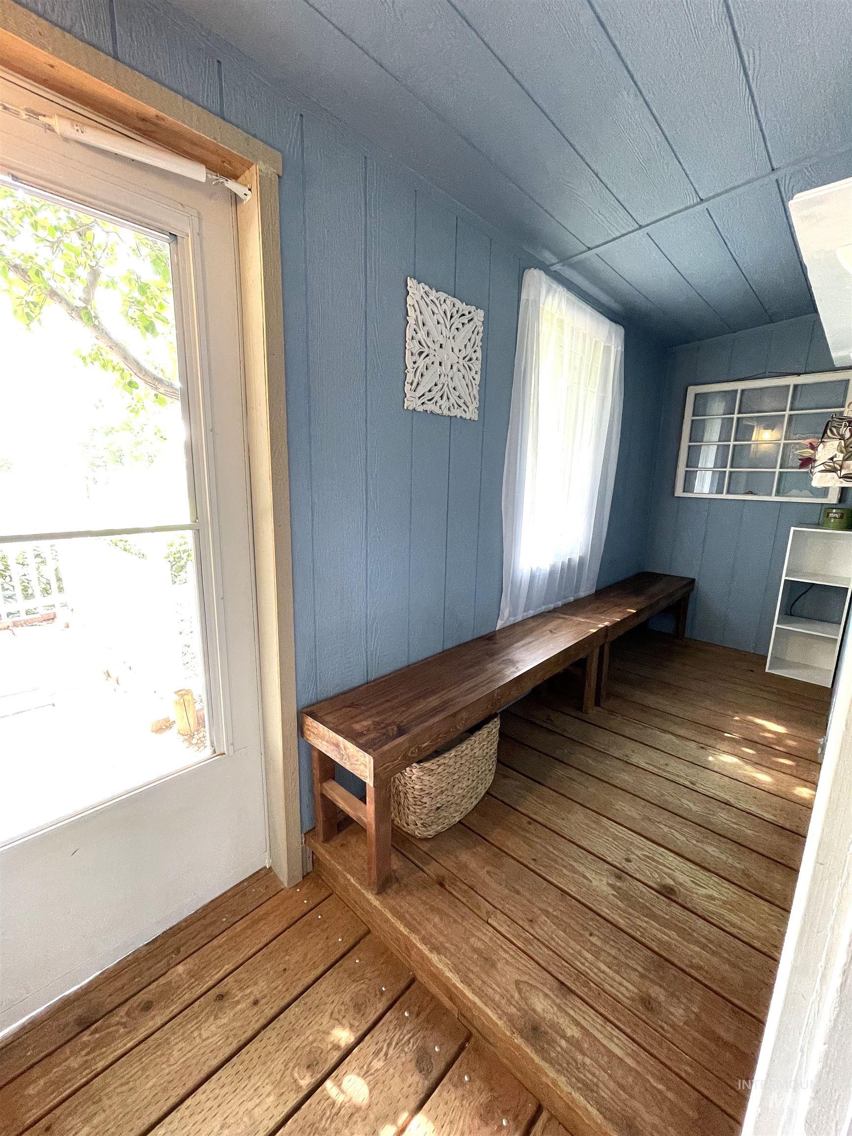 Mudroom with wood-type flooring