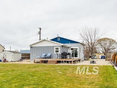 Fenced backyard with a deck