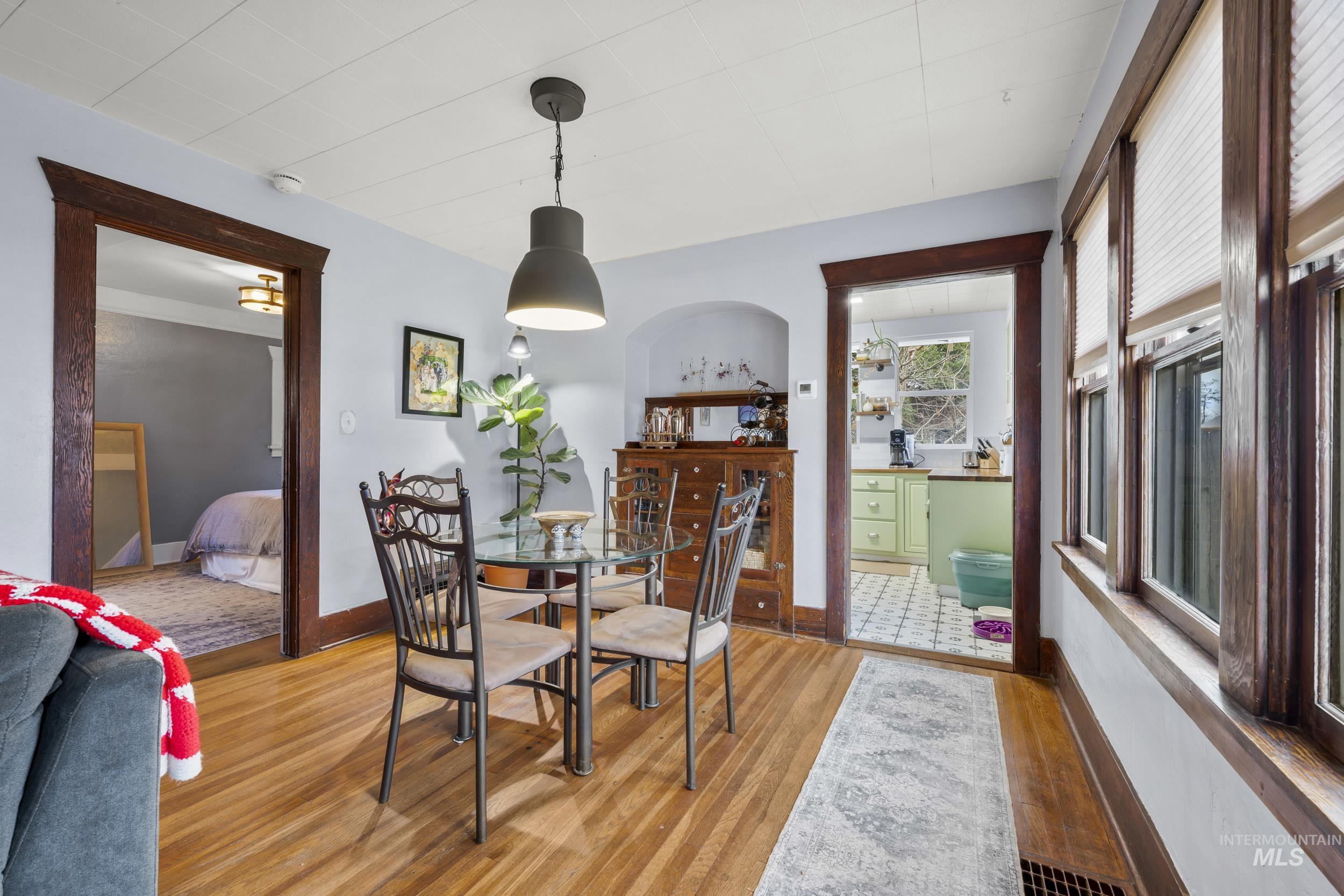 Dining area featuring light wood-style floors and baseboards