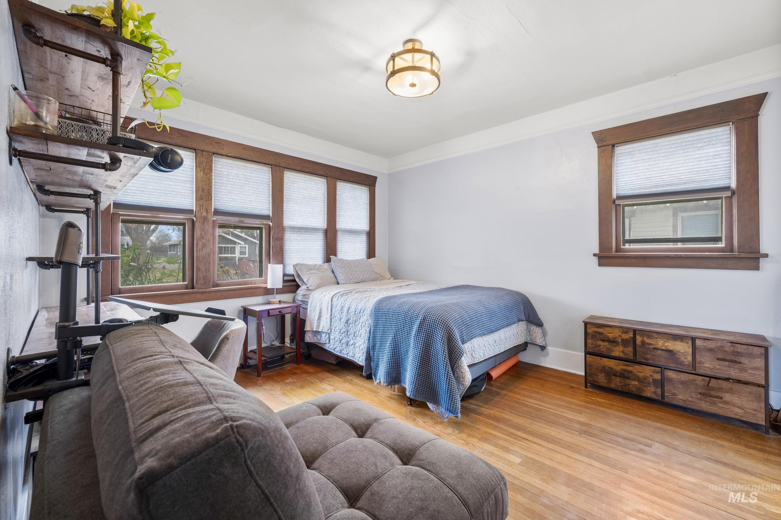 Bedroom with wood-type flooring
