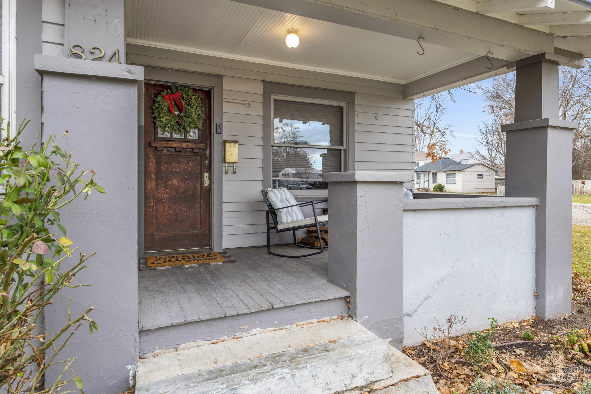 View of exterior entry with a porch