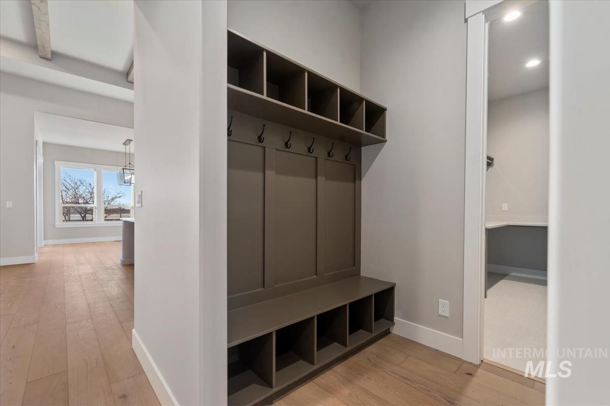 Mudroom with light wood-type flooring, recessed lighting, and beamed ceiling