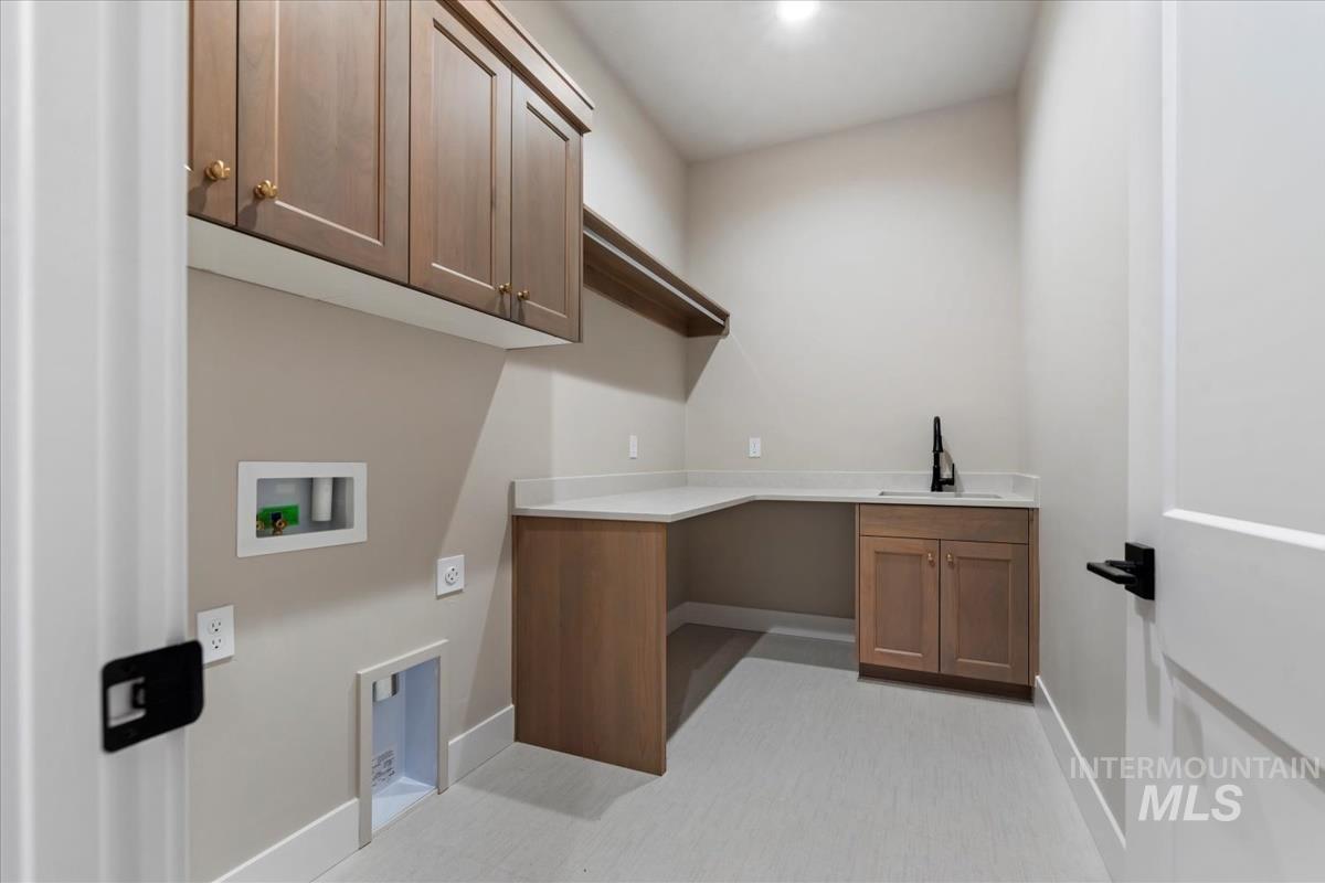 Laundry room featuring cabinet space and hookup for a washing machine