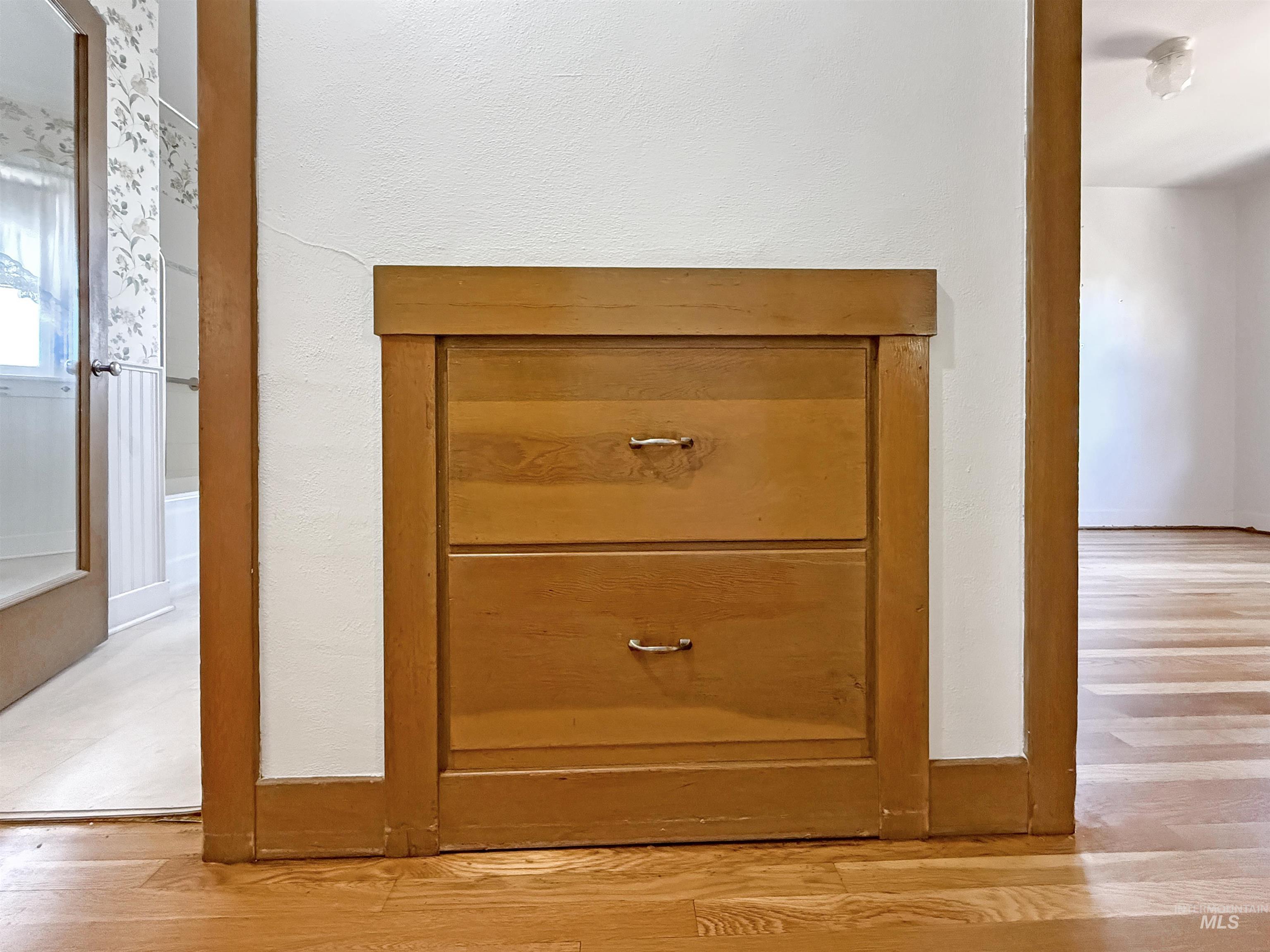 Detailed view of wood finished floors and baseboards