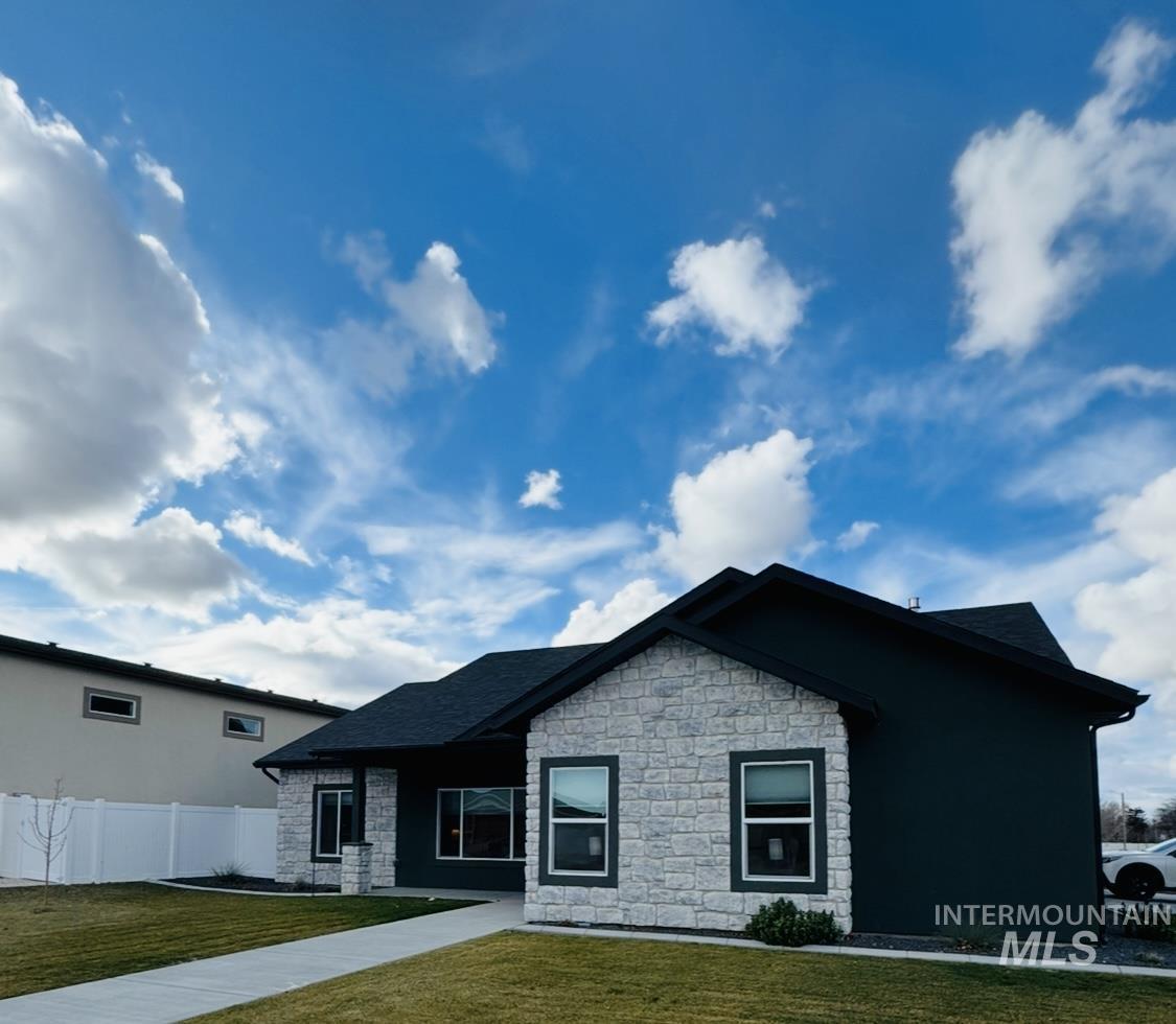 View of front of home featuring stone siding
