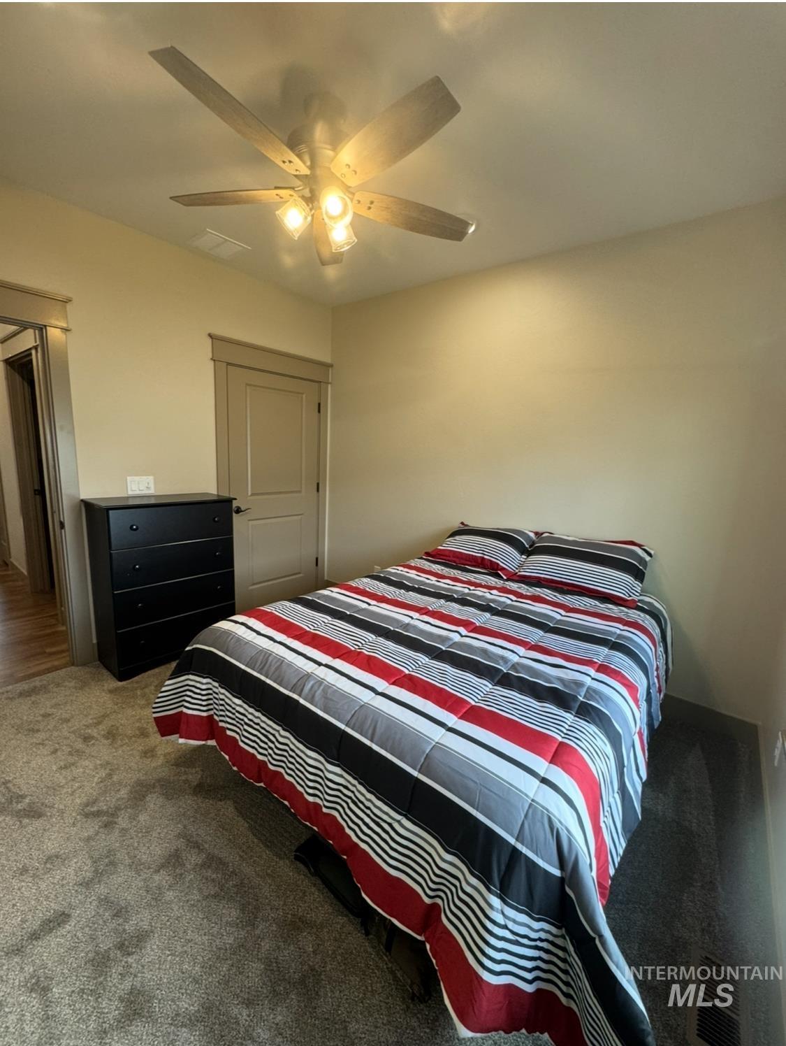 Bedroom with carpet and a ceiling fan