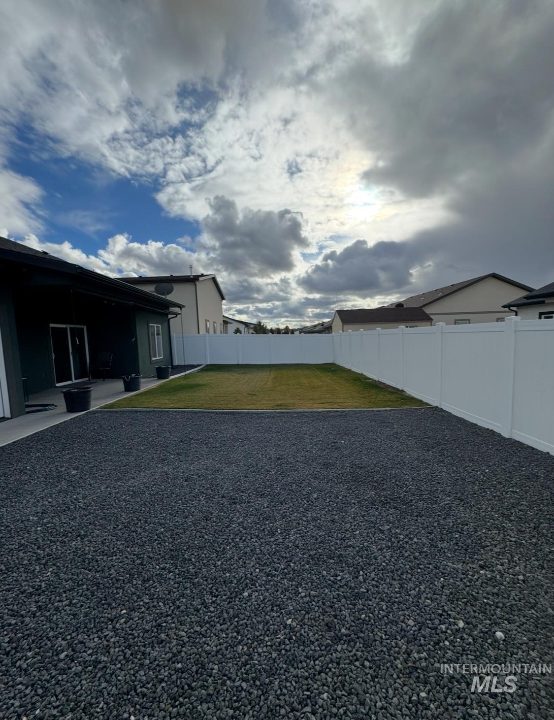 Fenced backyard featuring a patio area