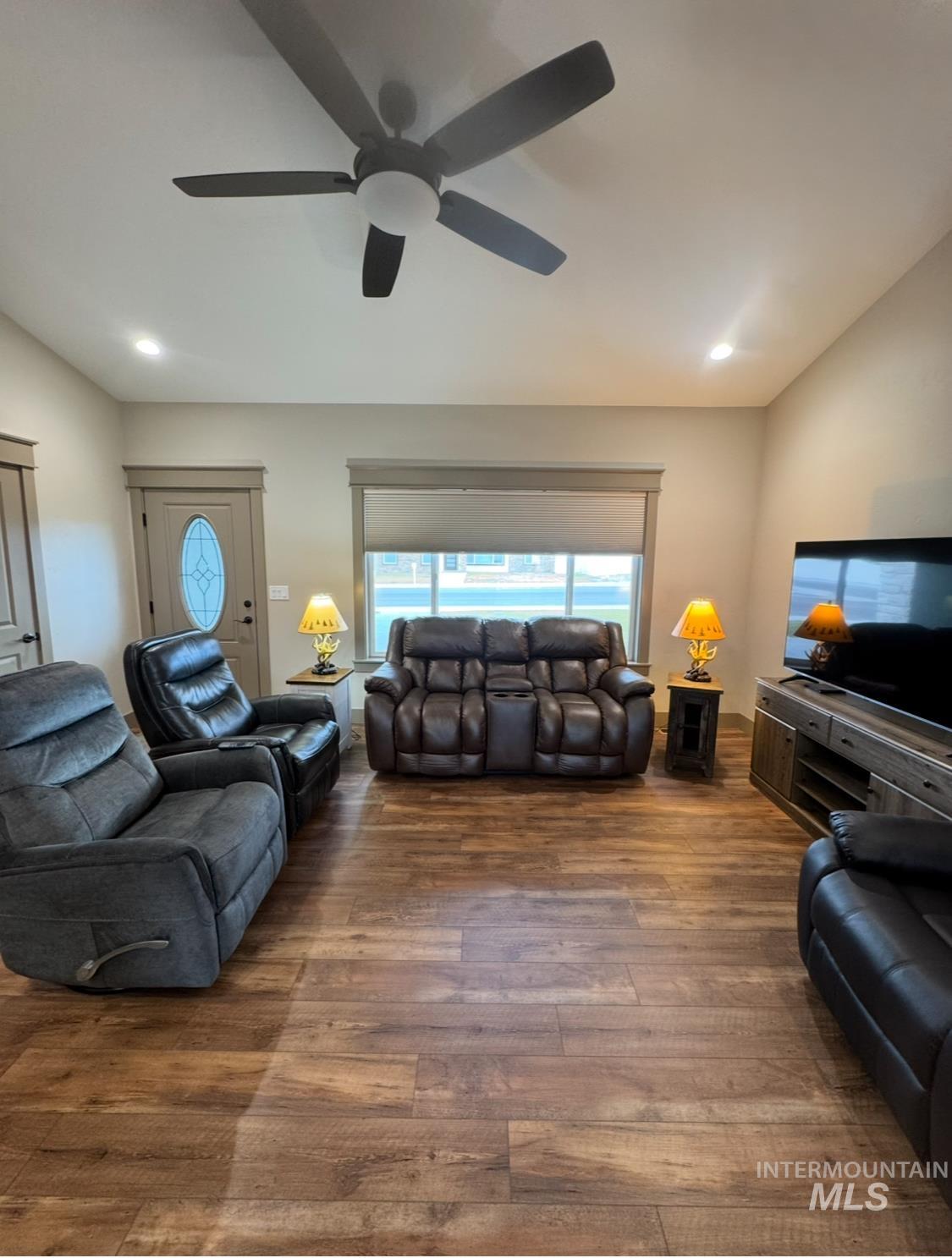 Living room featuring hardwood / wood-style flooring, recessed lighting, healthy amount of natural light, and a ceiling fan