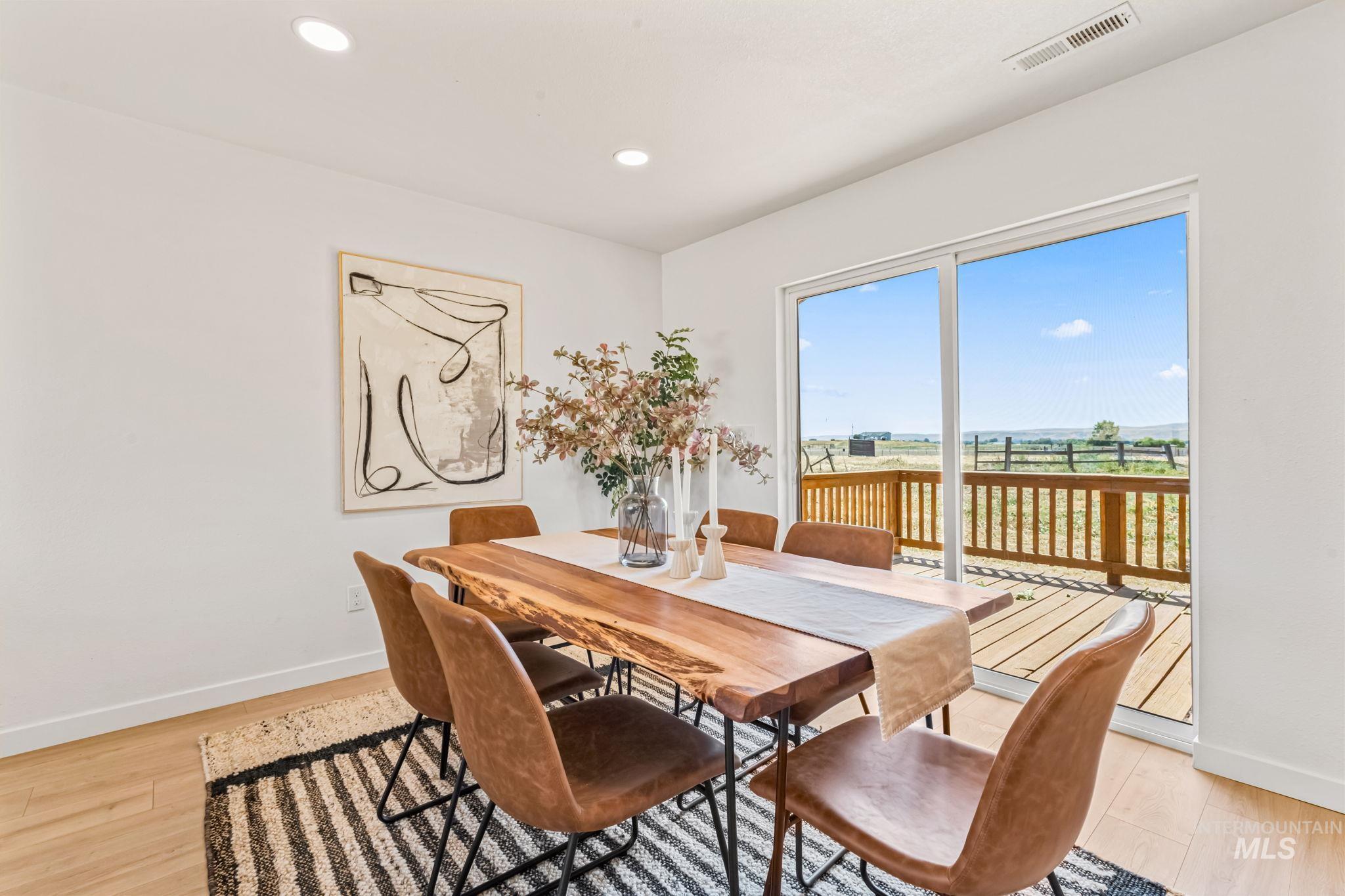 Dining area featuring light wood-type flooring and recessed lighting