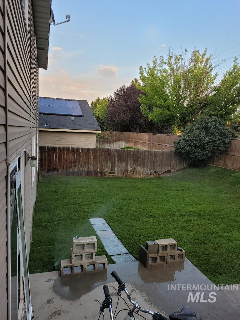 Fenced backyard with a patio