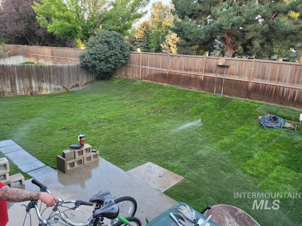 View of fenced backyard