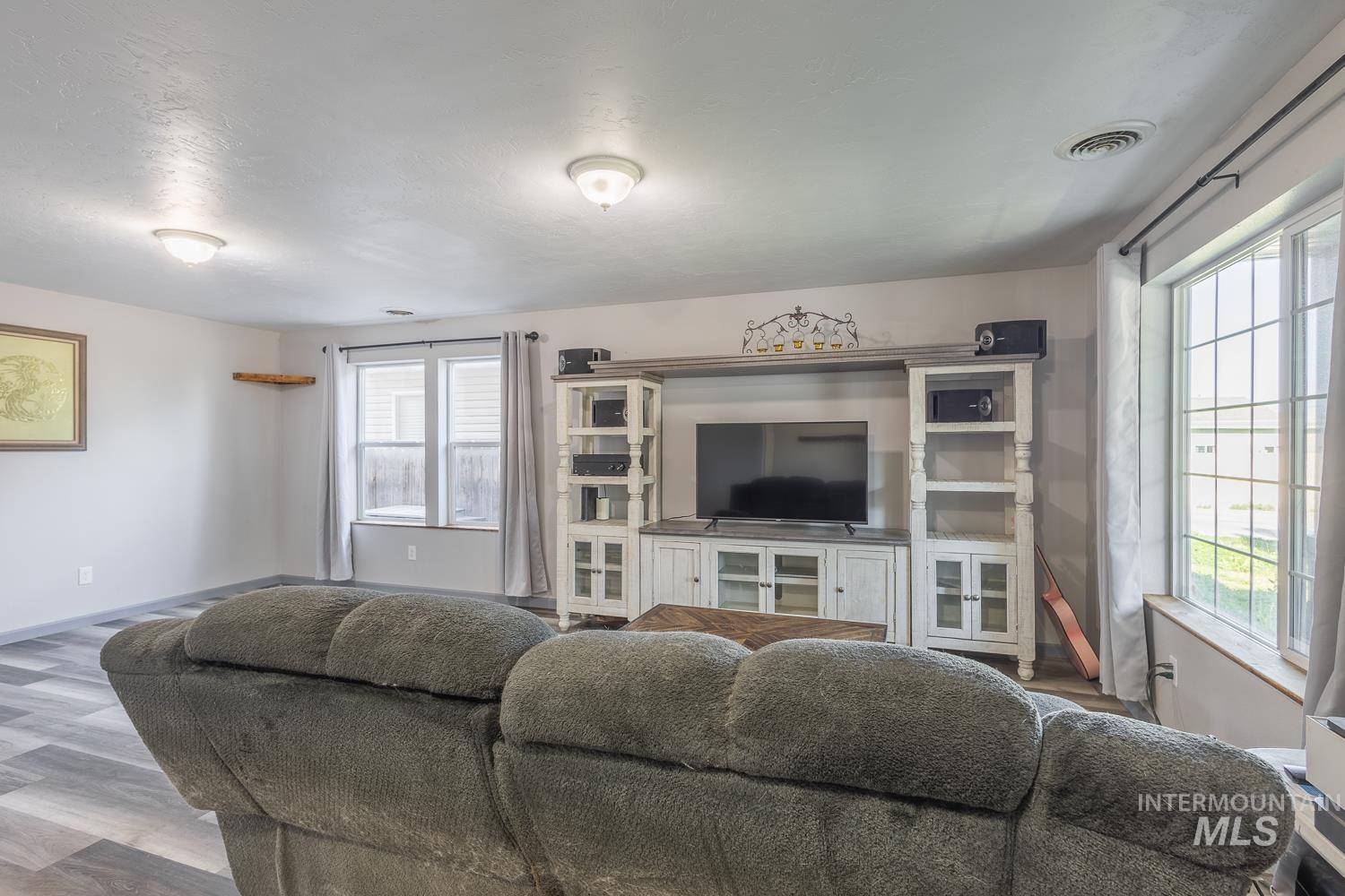 Living room featuring wood finished floors and baseboards