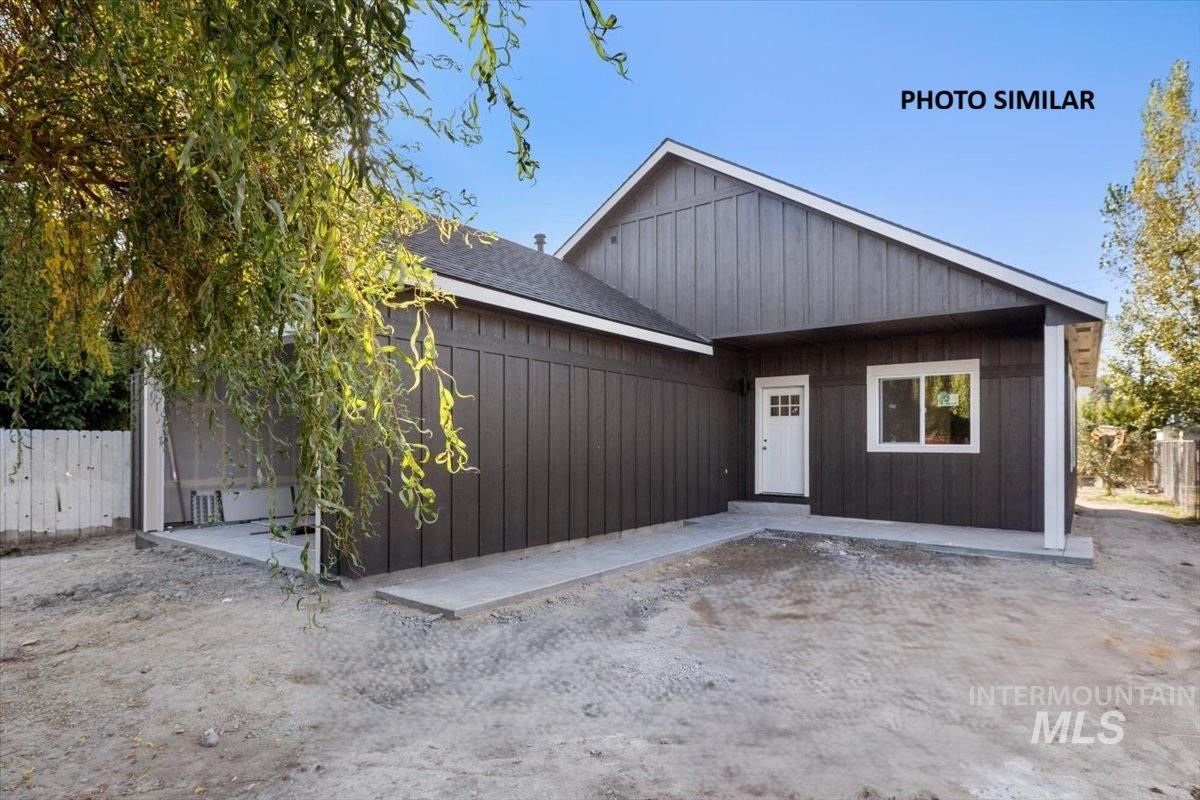 View of front of home with a shingled roof