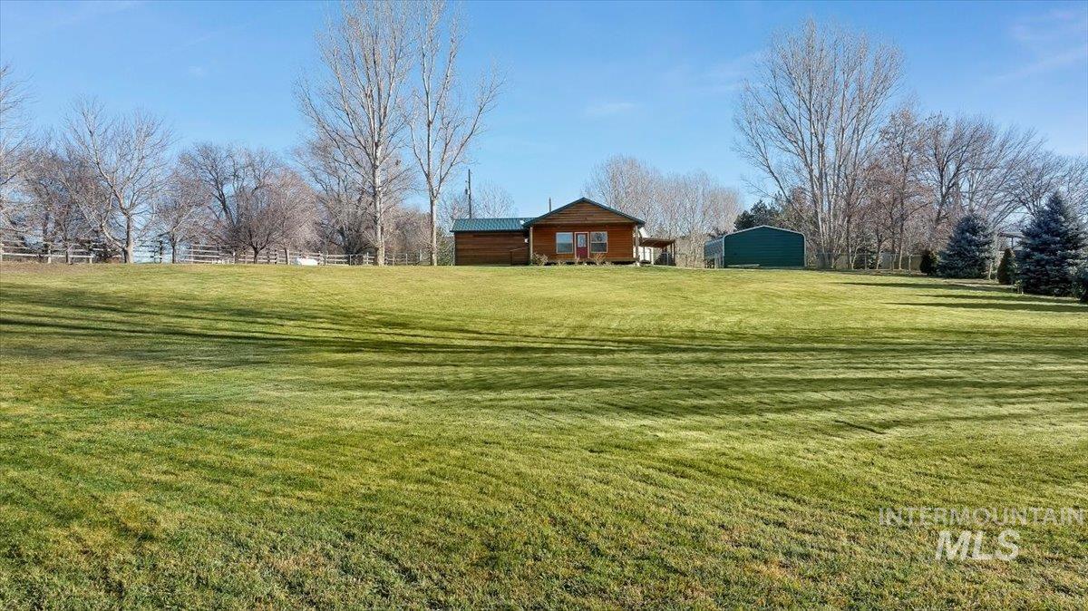 View of green lawn with a view of rural / pastoral area