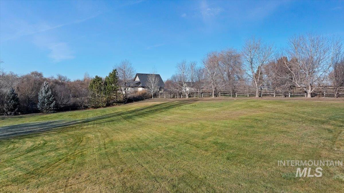 View of green lawn with a view of rural / pastoral area