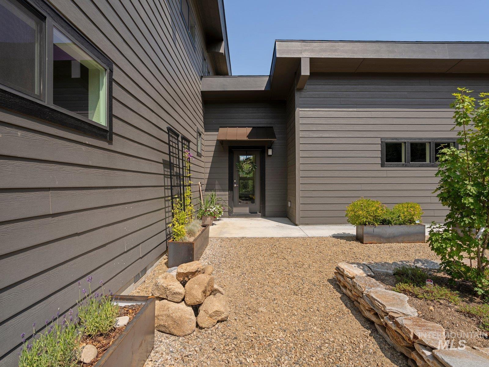 Front of house with landscaped courtyard