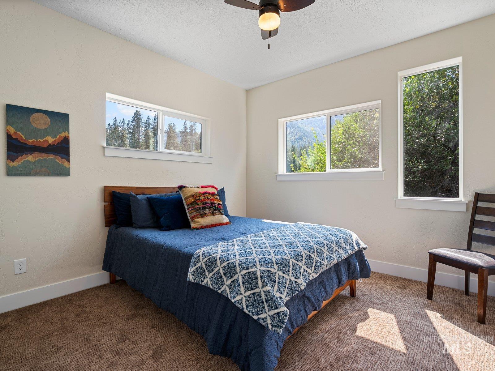 Bedroom featuring carpet flooring and ceiling fan