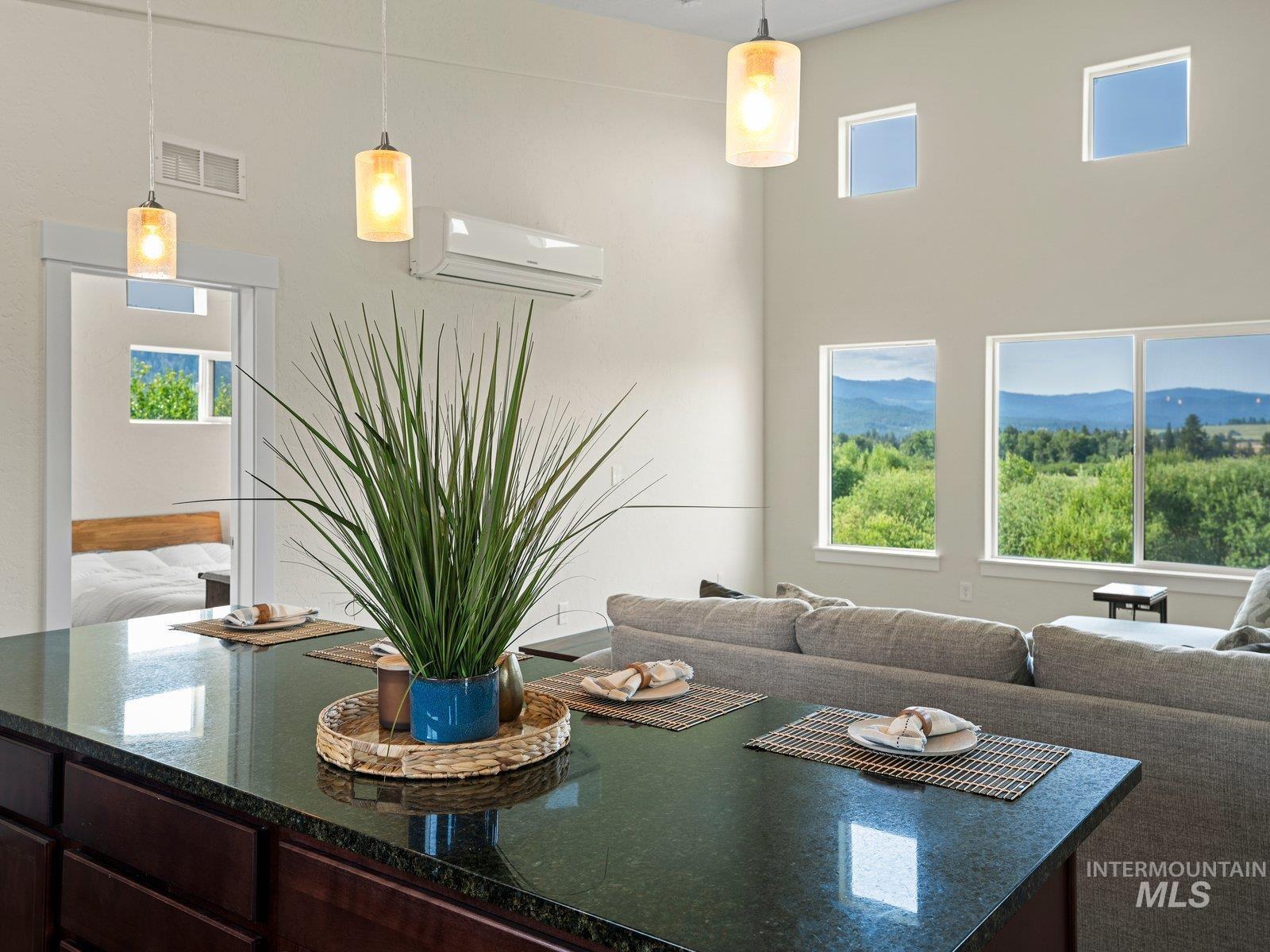 Living area with plenty of natural light and a wall mounted mini split