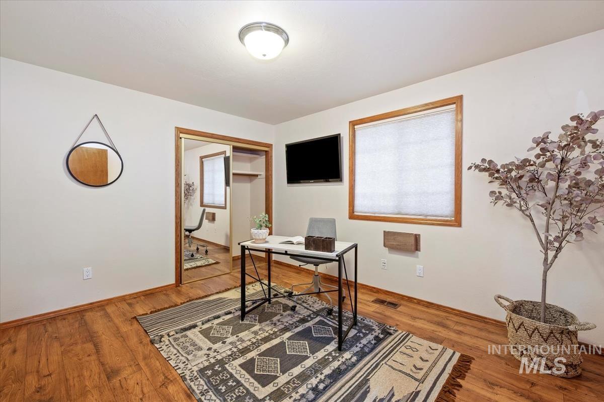 Office space featuring light wood-style flooring