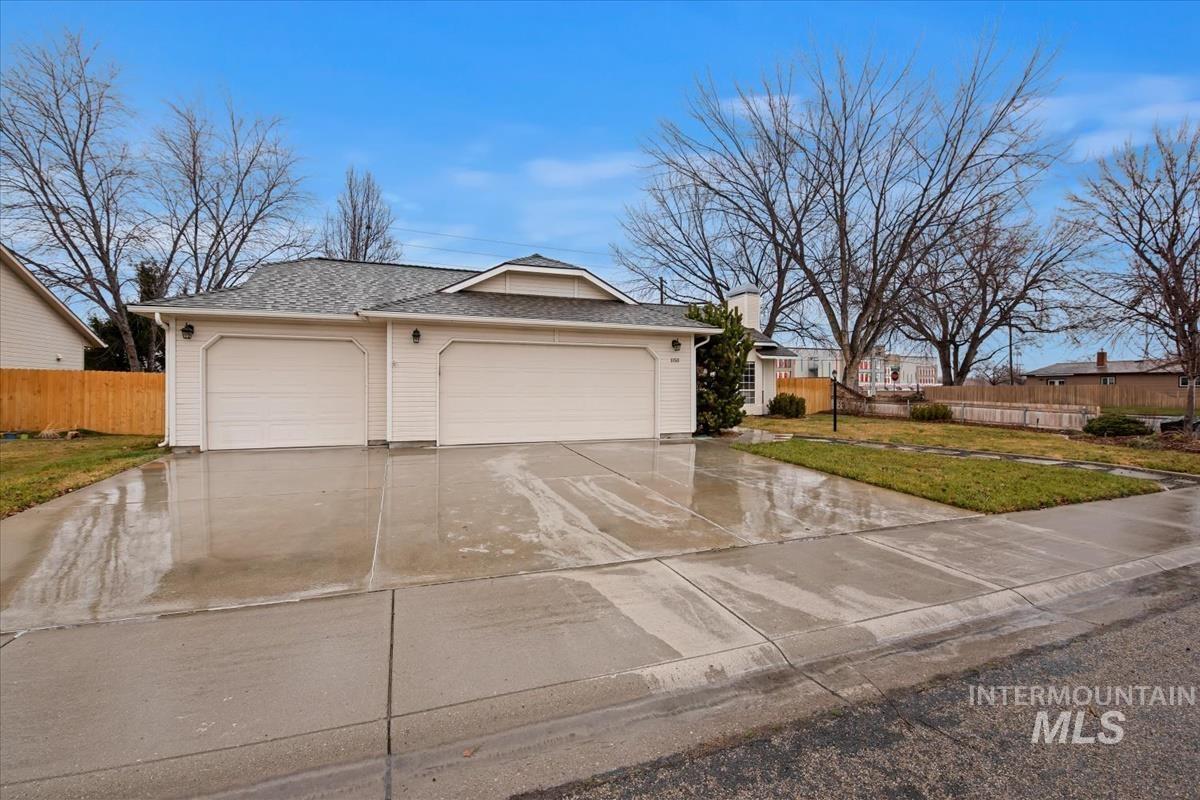 Garage featuring concrete driveway