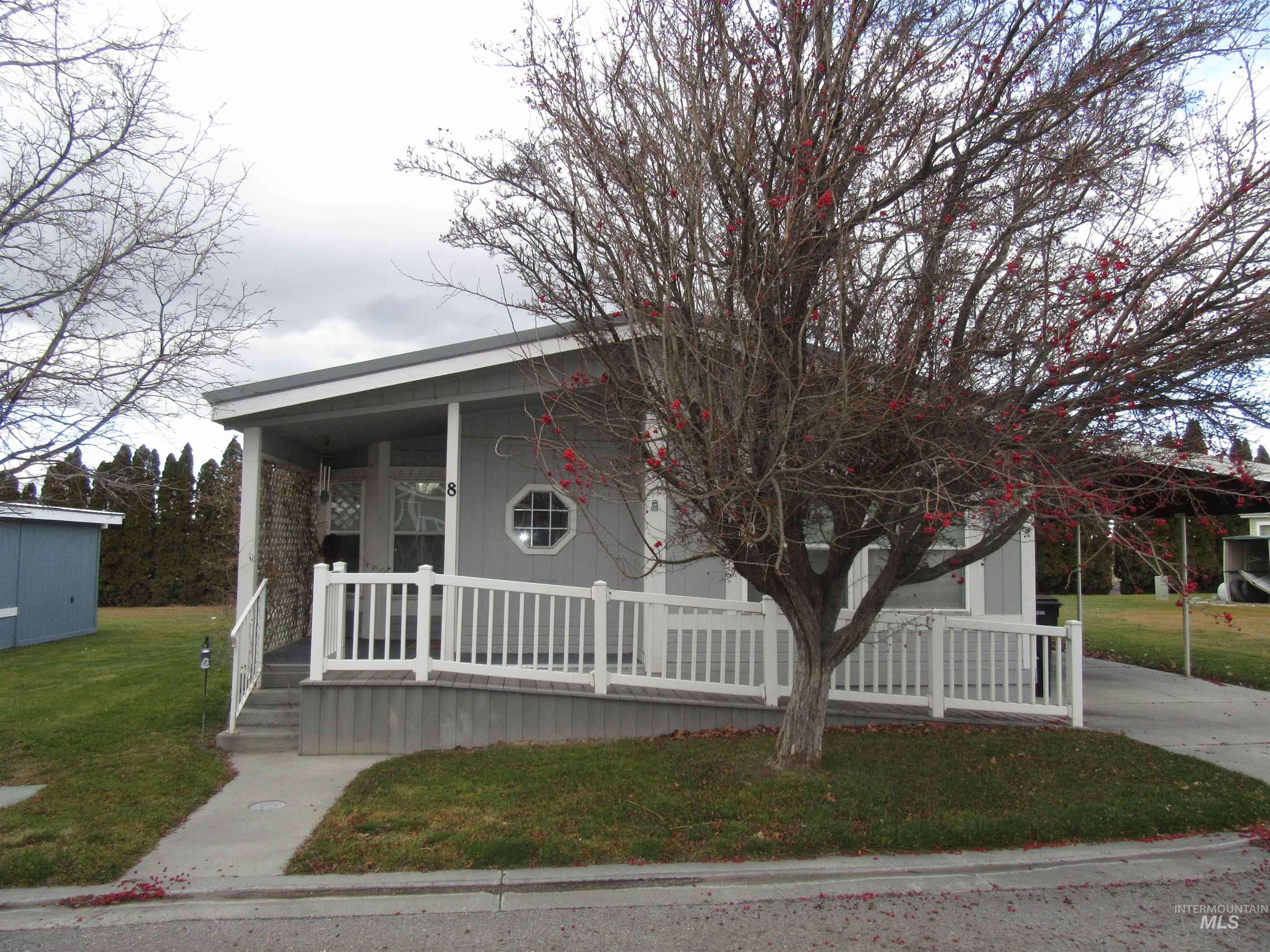 View of front facade featuring a porch and a front lawn