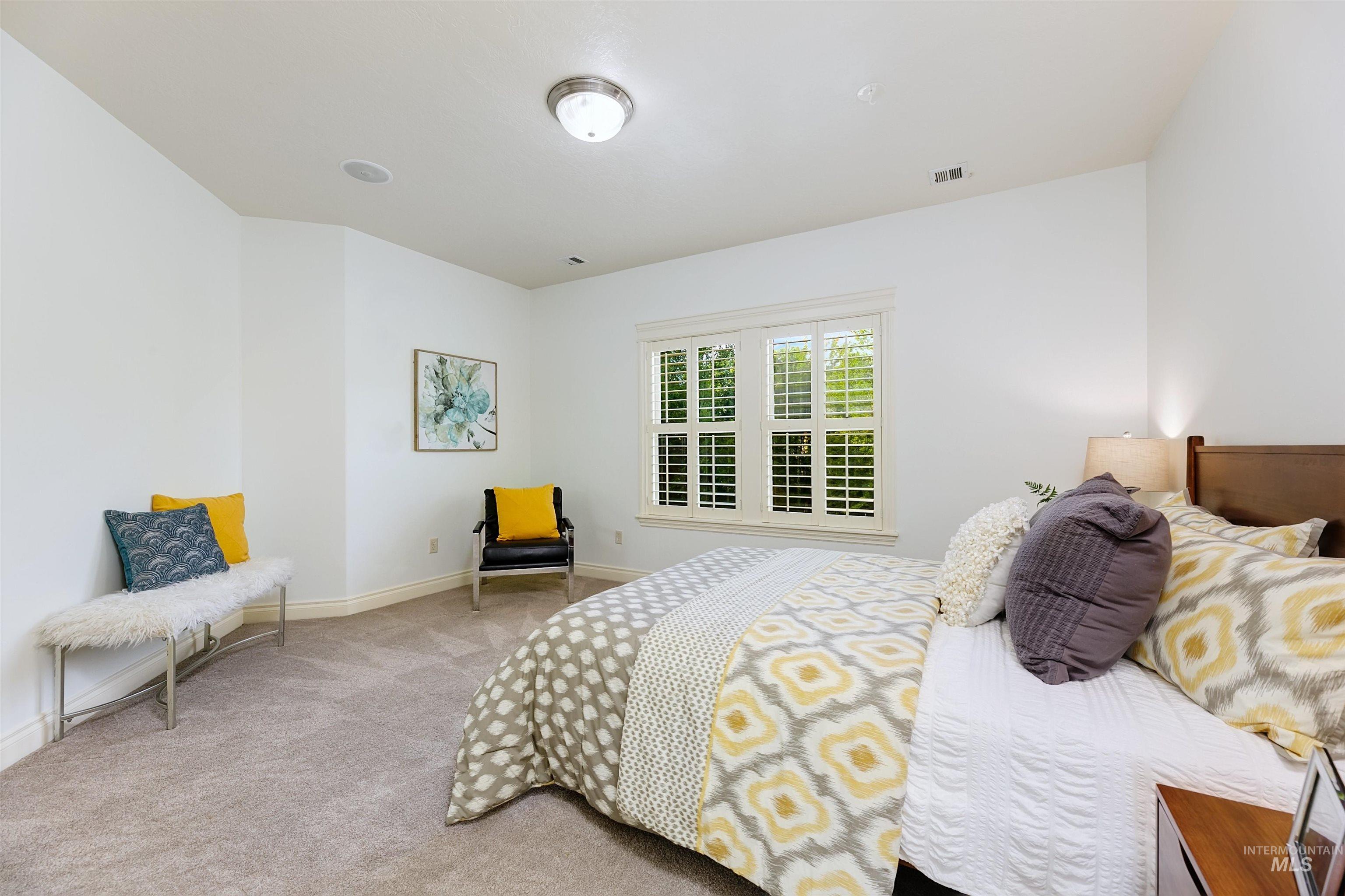 Bedroom with carpet floors and baseboards