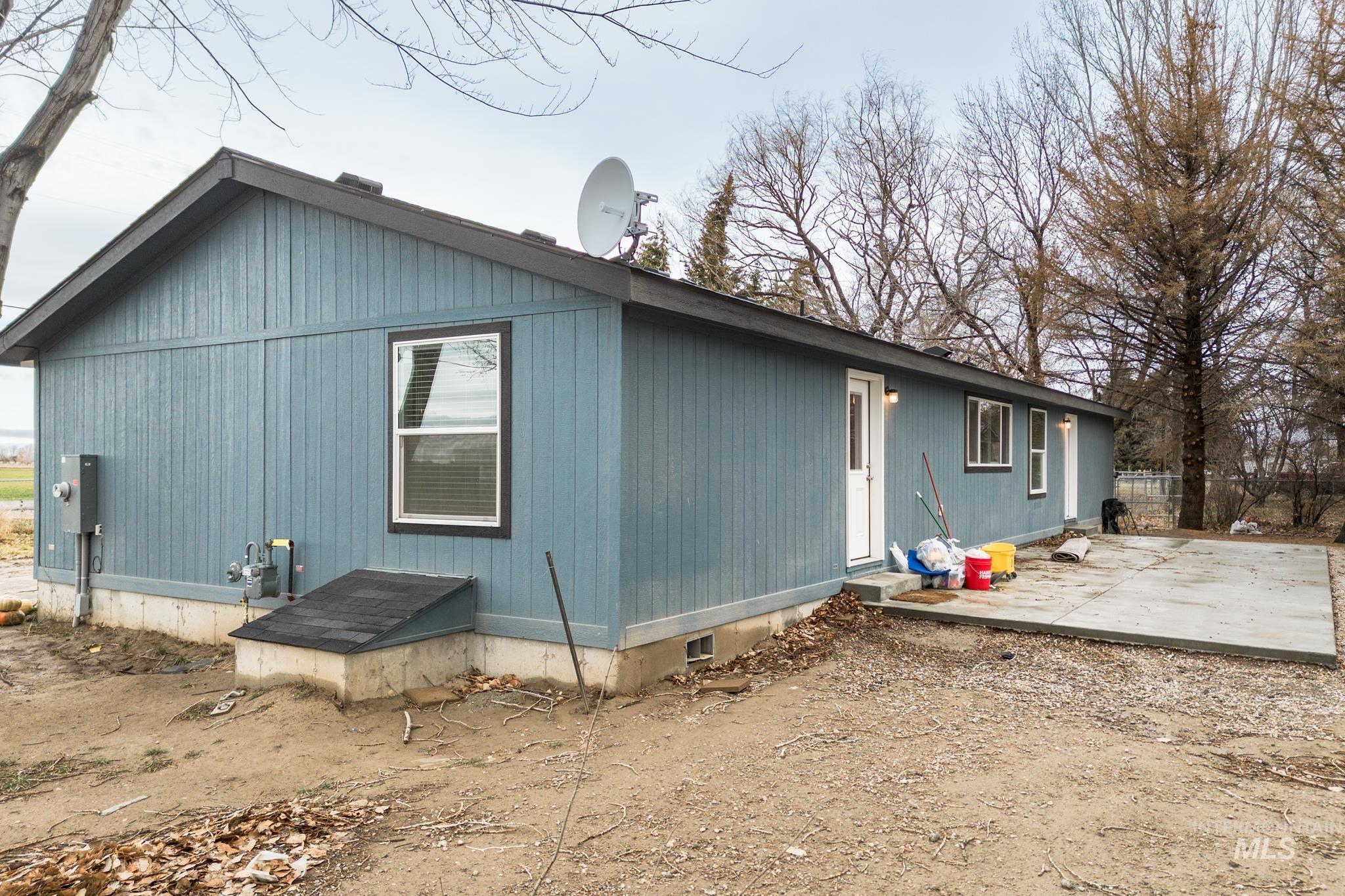 Rear view of house with a patio